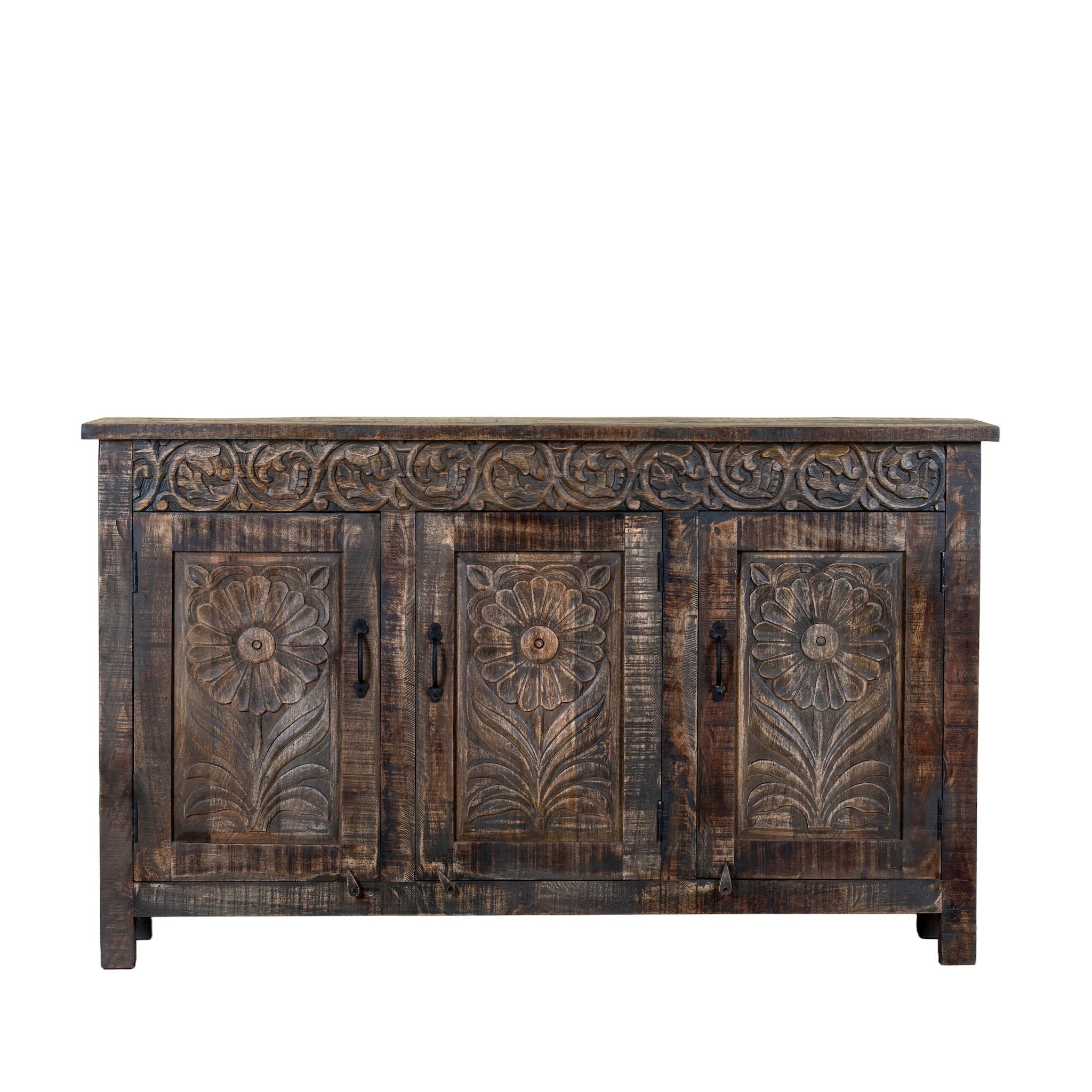 White background image of a of a dark brown hand carved mango wood sideboard with floral design and ample storage.