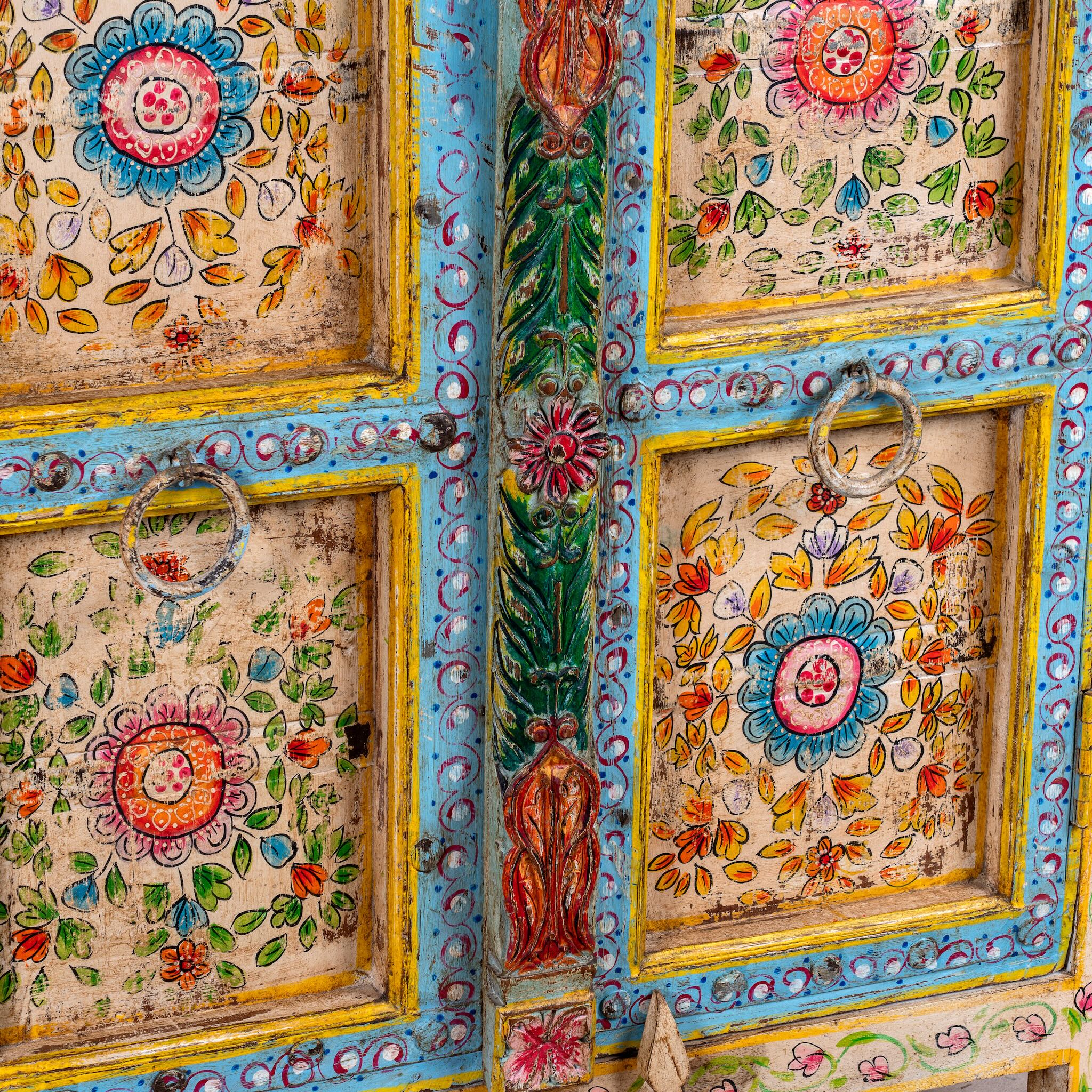 Close up image of a Aashish-hand-painted-sideboard-reclaimed-wood-150cm with floral design.