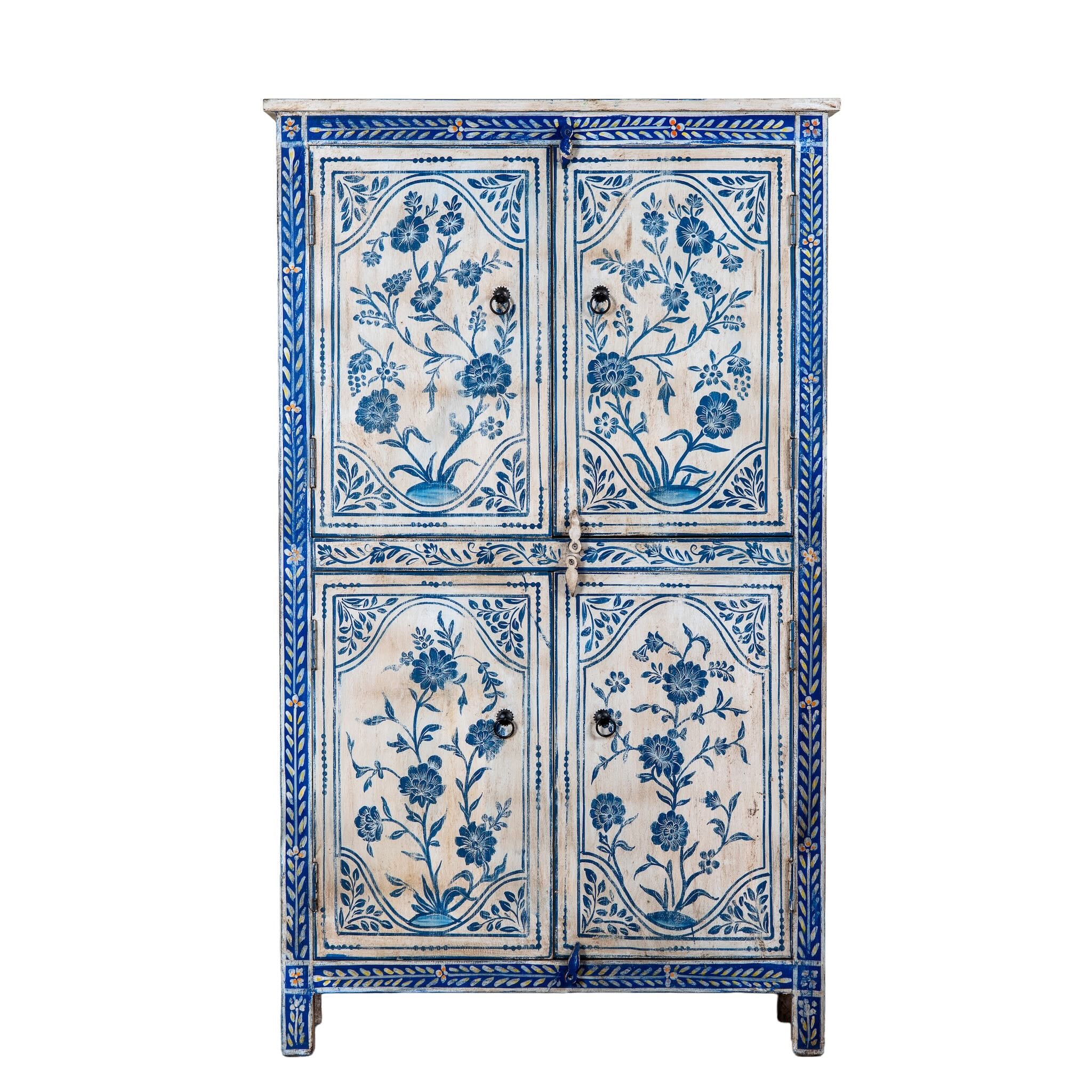 White background image of a unique hand painted wardrobe made of reclaimed wood with floral design, 4 doors and ample storage.