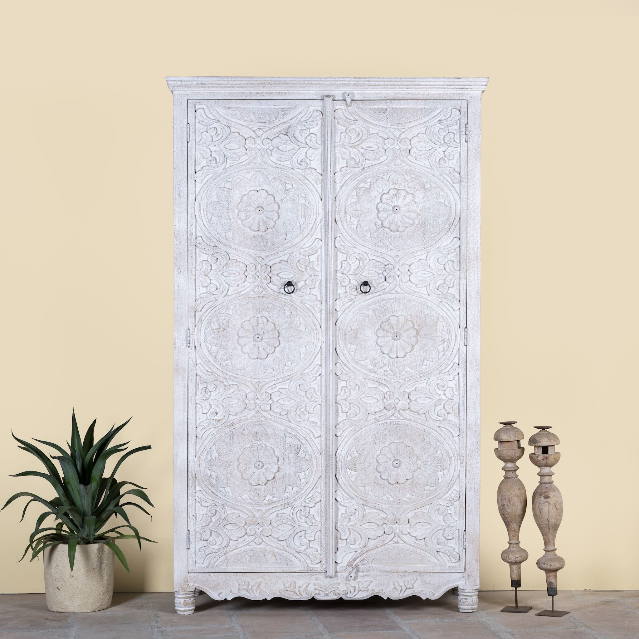 Image of a hand carved white washed mango wood wardrobe in vintage design.