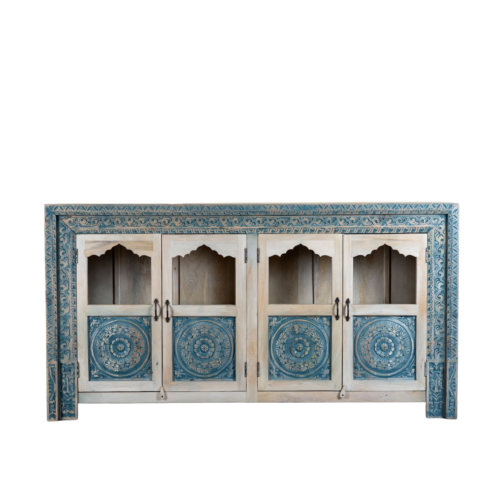 White background image of a hand carved showcase made of natural mango wood in white washed with blue floral accents and half glass doors in vintage design.