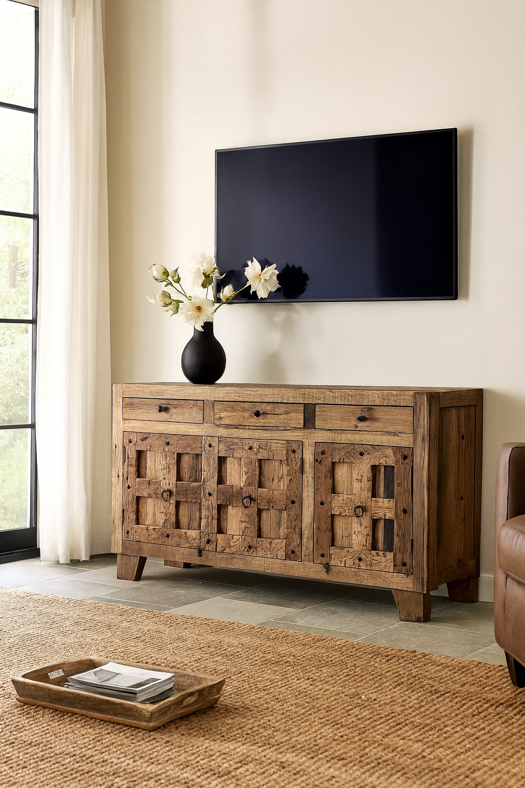 Lifestyle imagination of a rustic design sideboard made from reclaimed wood with panelled doors, drawers, and iron accents; 150 × 40 × 90 cm.