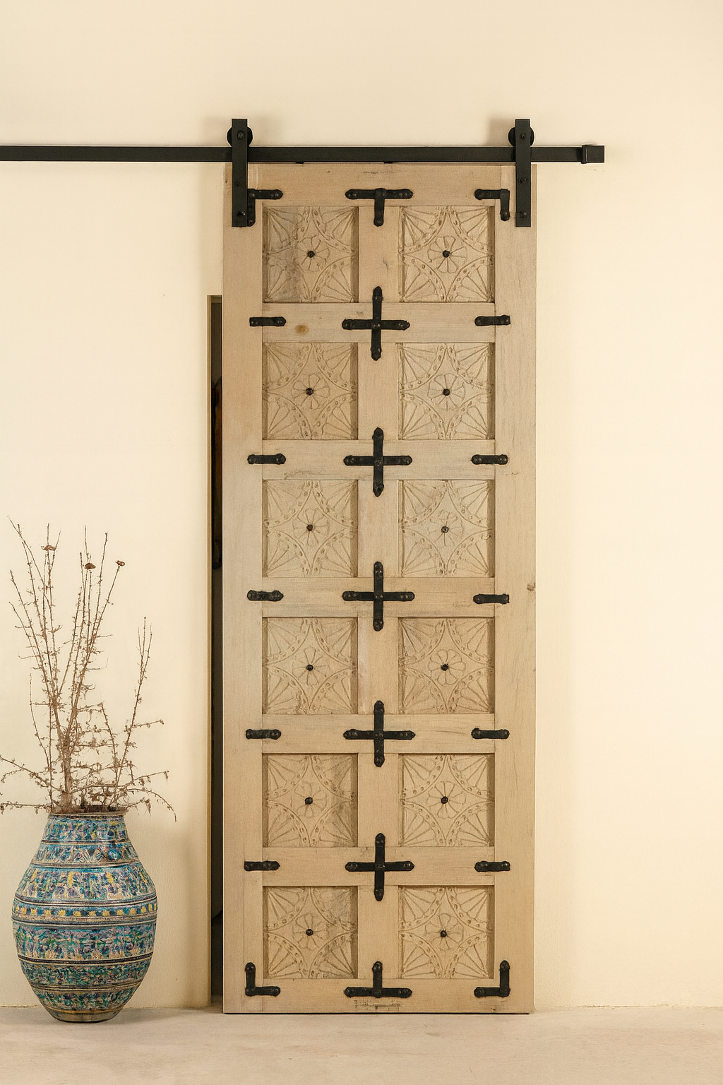 Decorative wooden sliding door with geometric patterns on a beige wall.