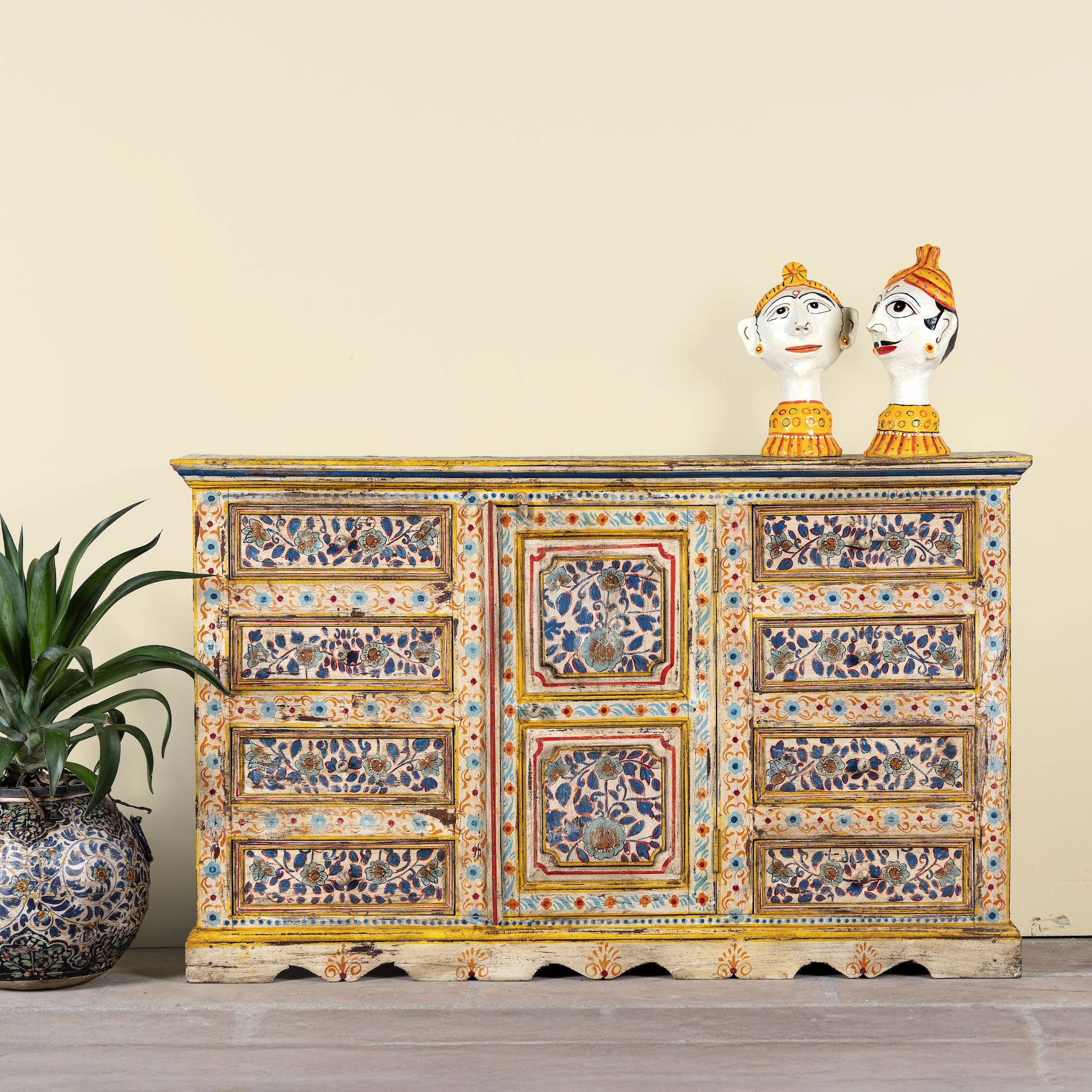 Hand-painted reclaimed wood sideboard with floral motifs – a unique piece of sustainable furniture for vibrant Indian home decor.