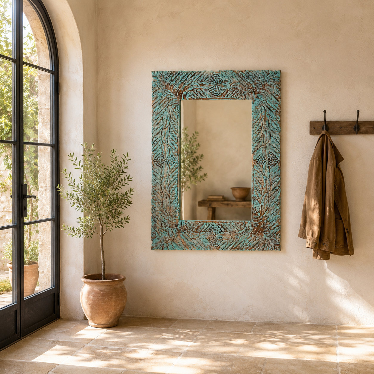 Lifestyle imagination of a carved mango wood mirror Anumati with floral hand-carving and distressed finish. A unique Indian furniture piece perfect for vintage home decor and bohemian interiors.