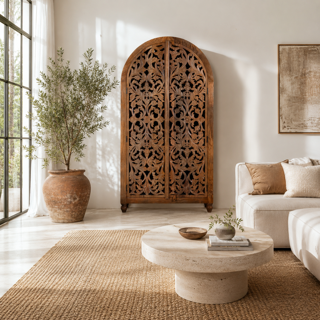 Lifestyle imagination of a of a hand carved wooden wardrobe with arc-shaped cabinet design in solid mango wood – Aranya model by Om Home & Garden