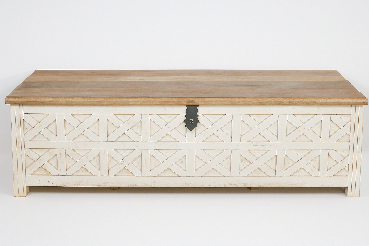 White background image of a hand-carved mango wood vintage chest front view – styled in Mediterranean living room with books, candles, natural textures, and soft daylight.