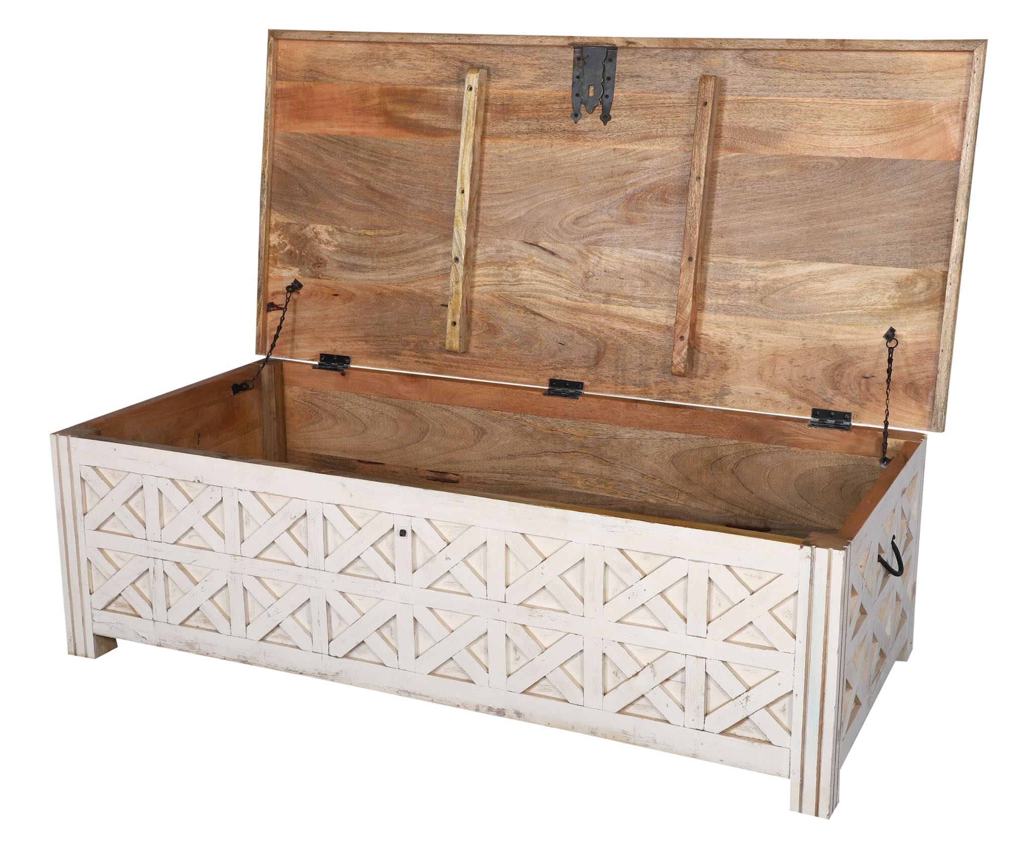 Image showing open lid of a hand-carved mango wood vintage chest front view – styled in Mediterranean living room with books, candles, natural textures, and soft daylight.