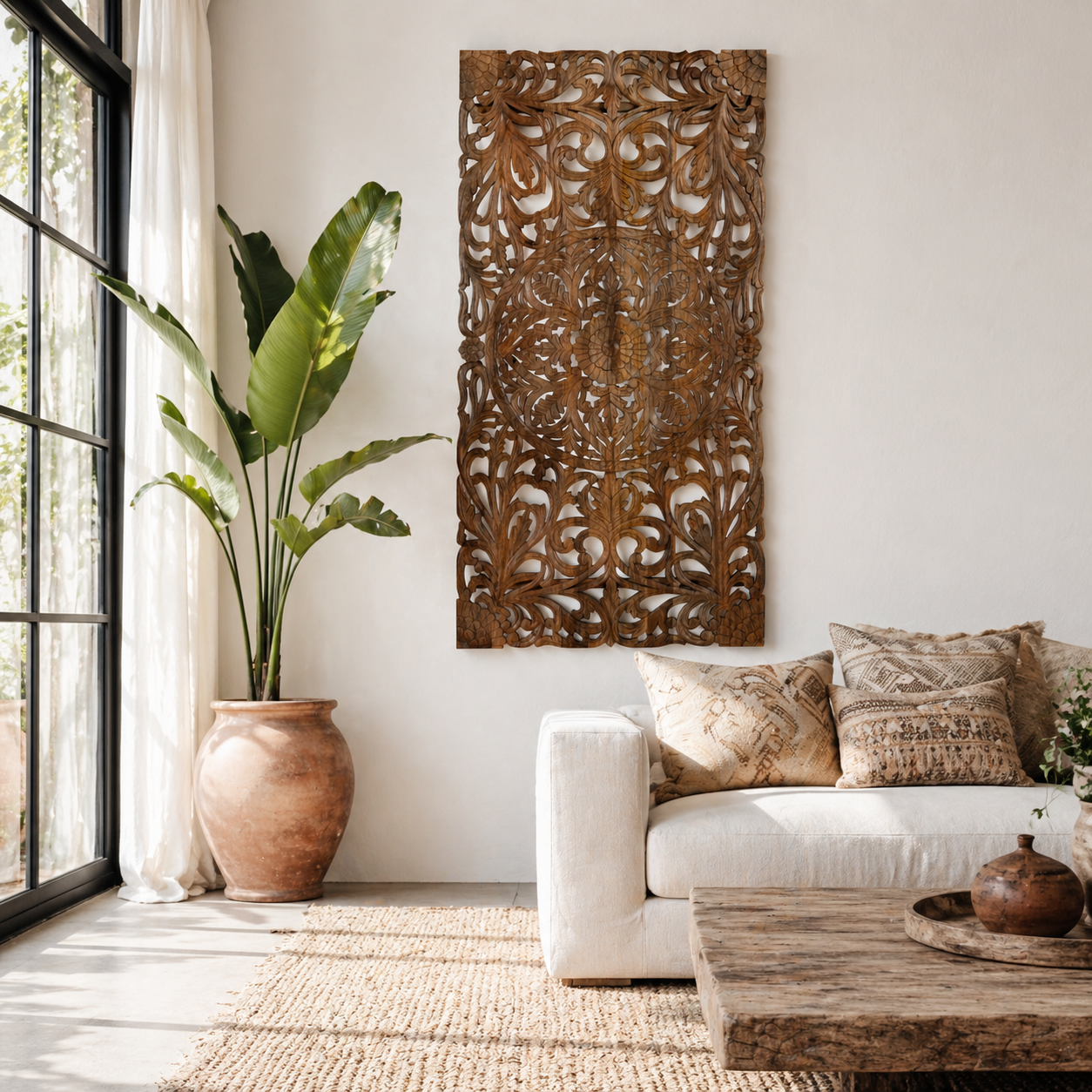 Lifestyle image of a hand-carved mango wood wall panel with intricate floral design and natural finish – Aruna model by Om Home & Garden