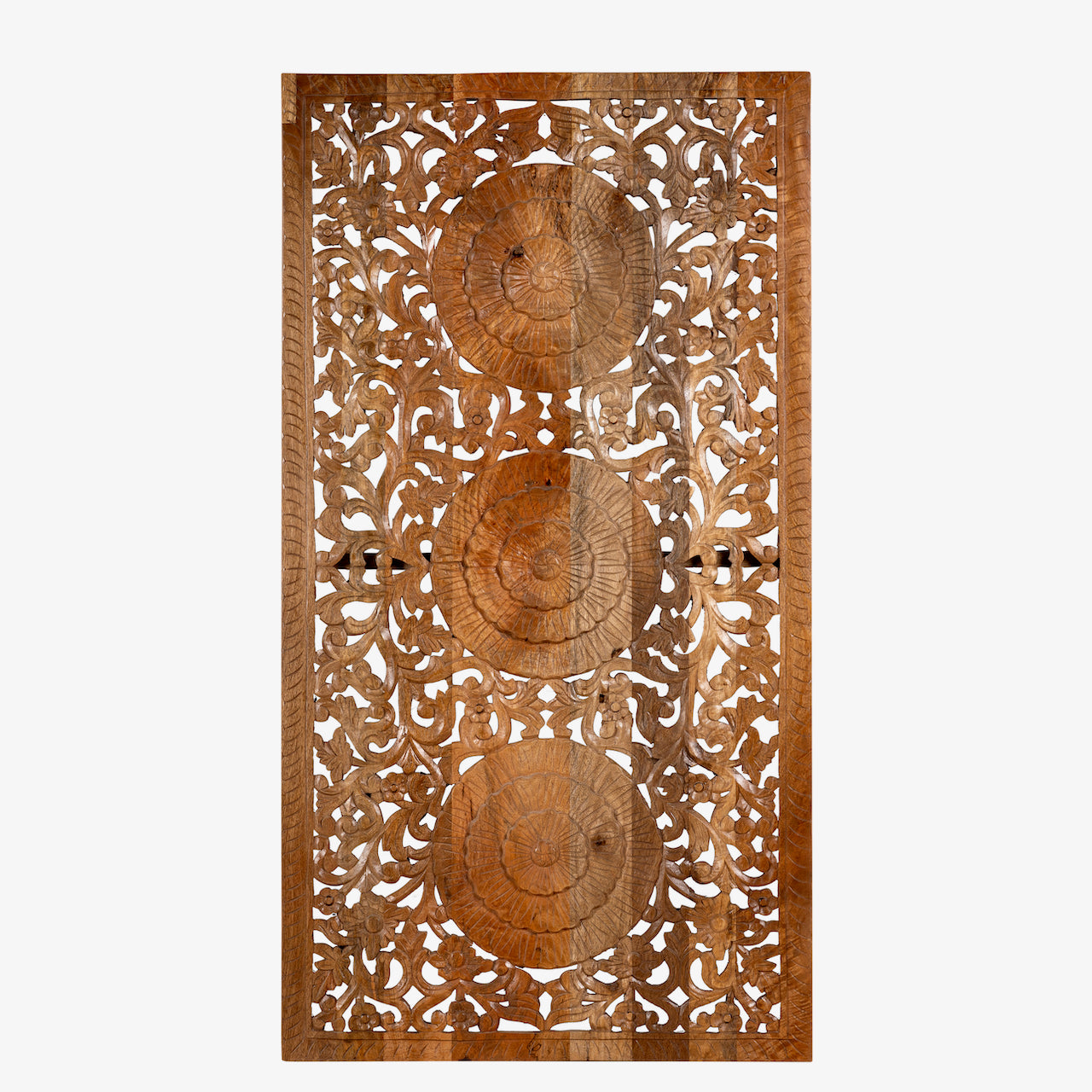 White background image of a hand-carved mango wood wall panel with floral engravings in natural finish – Arusha model by Om Home & Garden