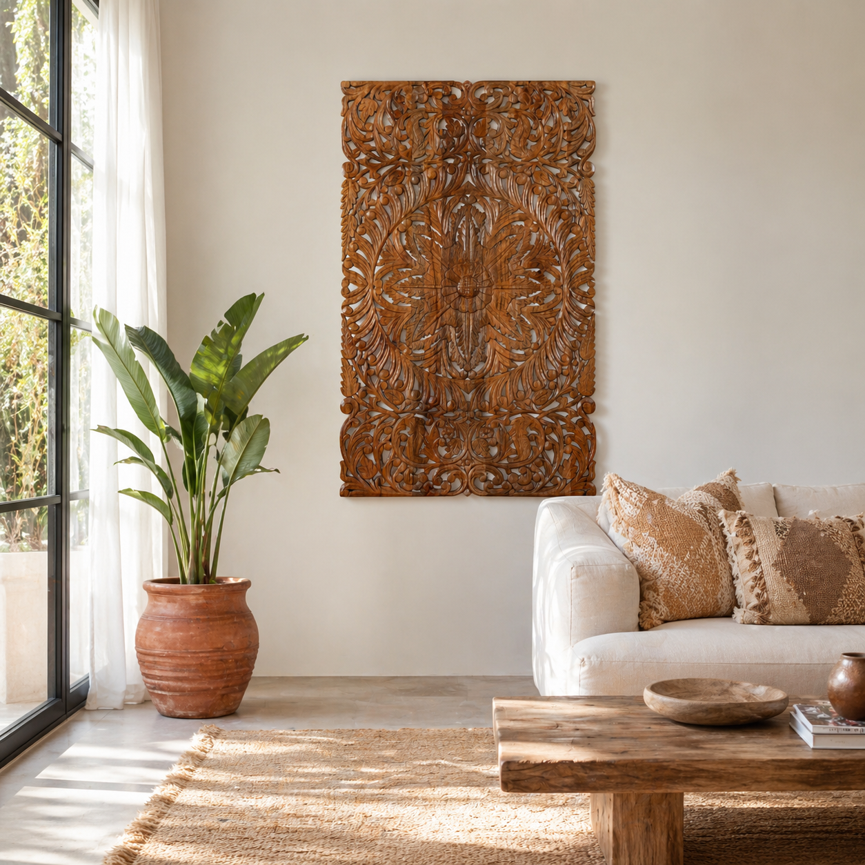 Lifestyle scene with a hand-carved mango wood wall panel with floral motifs in natural finish – Arvavasu model by Om Home & Garden