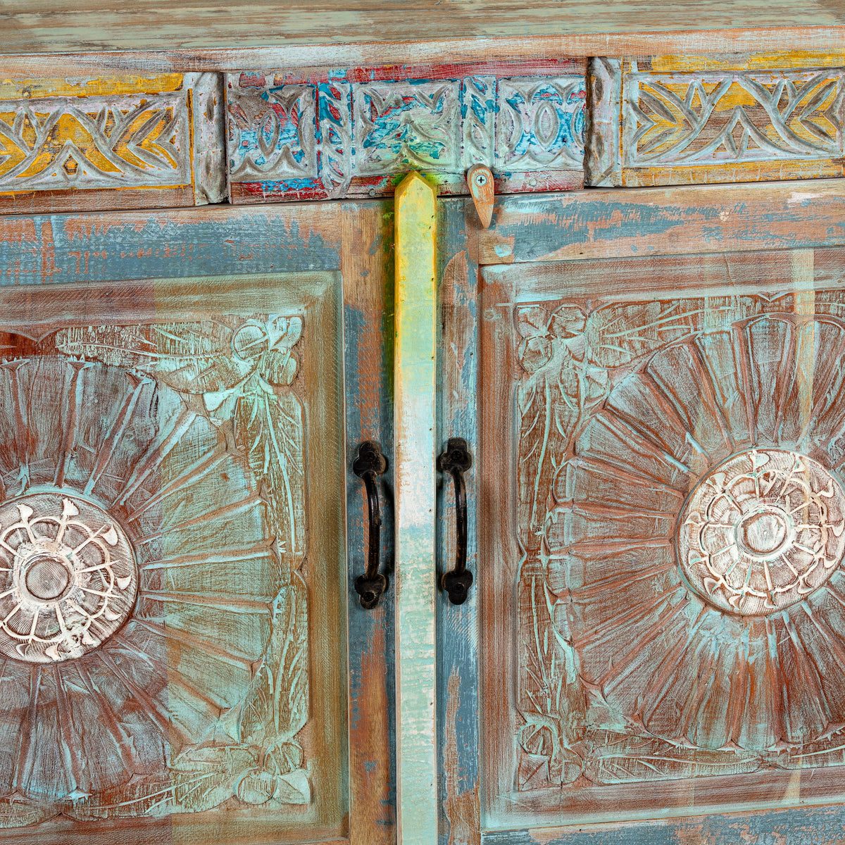Close up image of a Aryen hand carved reclaimed wood sideboard with vintage house elements and distressed blue turquoise finish 120cm