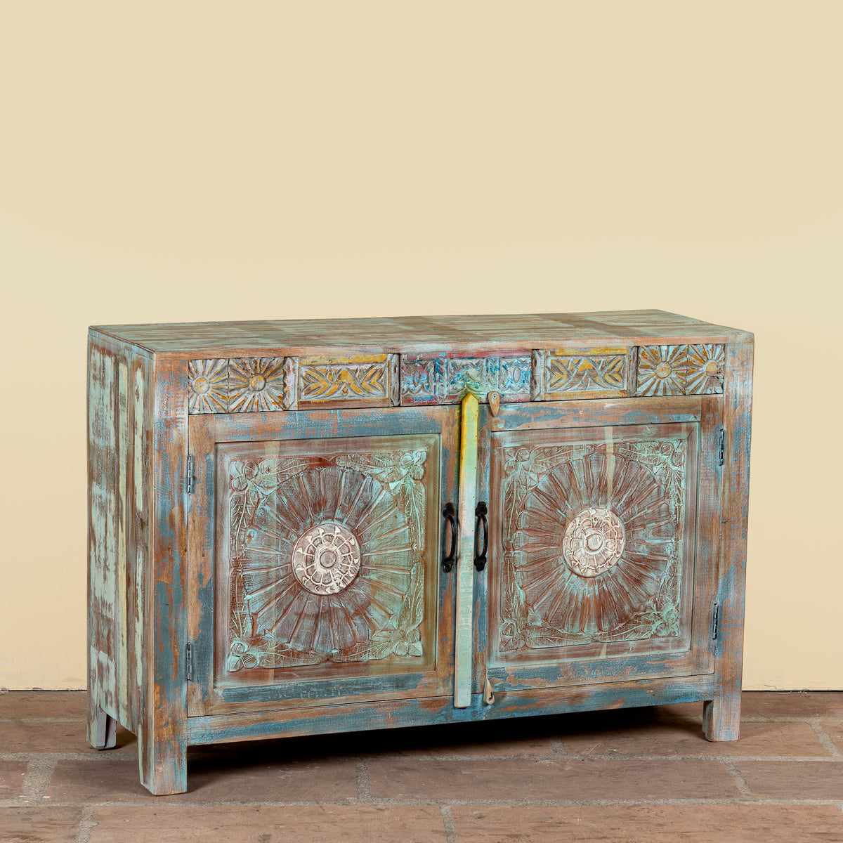 Side angle image of a Aryen hand carved reclaimed wood sideboard with vintage house elements and distressed blue turquoise finish 120cm