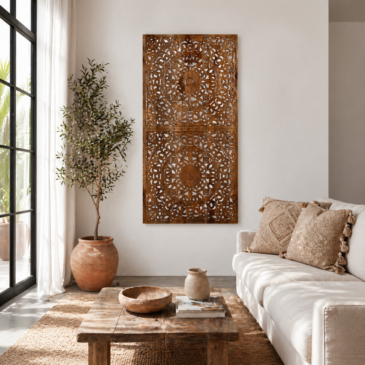 Lifestyle scene with a hand-carved mango wood wall panel in natural finish with floral designs – Asamanja model by Om Home & Garden