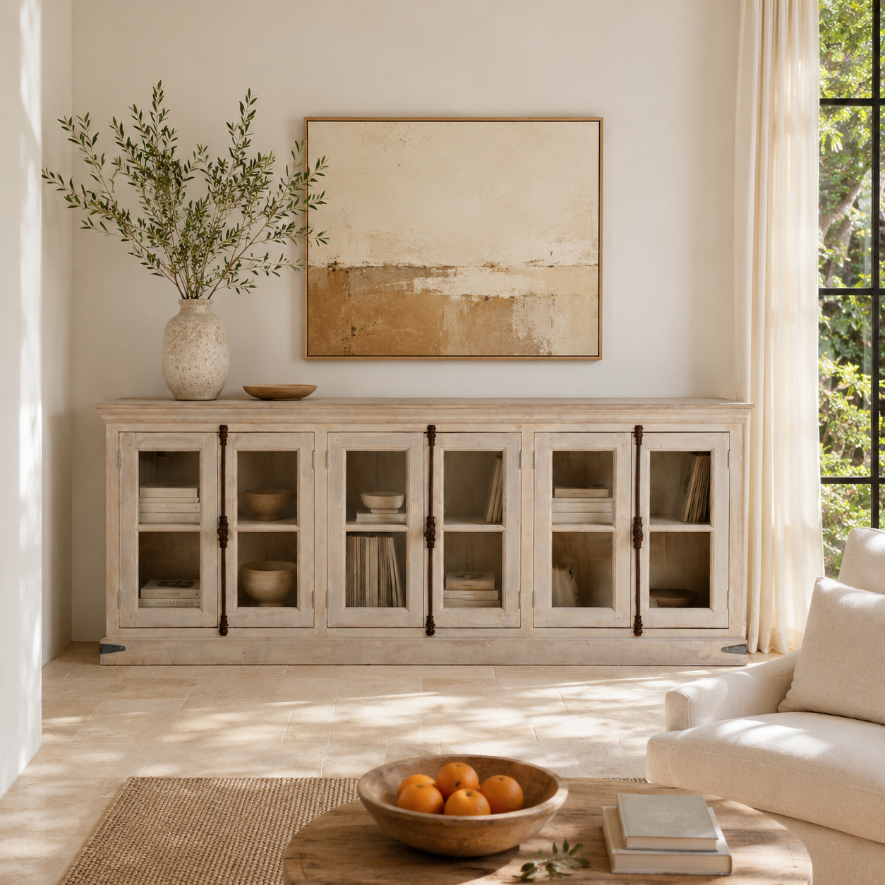 Lifestyle image of a sandblasted reclaimed wood sideboard in Ibiza style with six glass-panelled doors, vintage Mediterranean furniture, 263×45×100 cm.