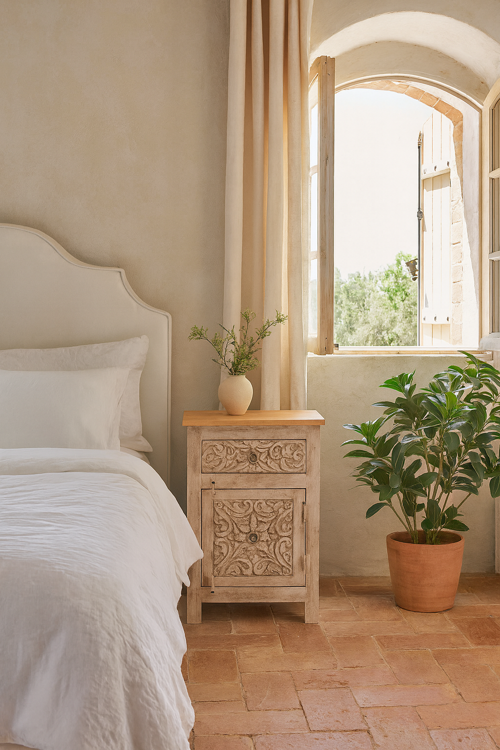 Life style image of a pair of vintage night stands in mango wood with hand-carved geometric details and distressed finish; ideal for vintage home decor, 76 × 56 × 35 cm.