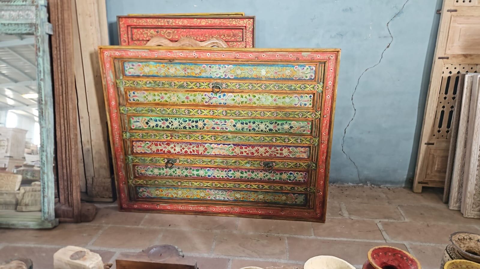 Cauvery hand painted head board made from an antique Indian teak door, featuring traditional floral motifs in blue and cream and original iron hardware—an elegant example of hand painted head boards and authentic Indian headboards.