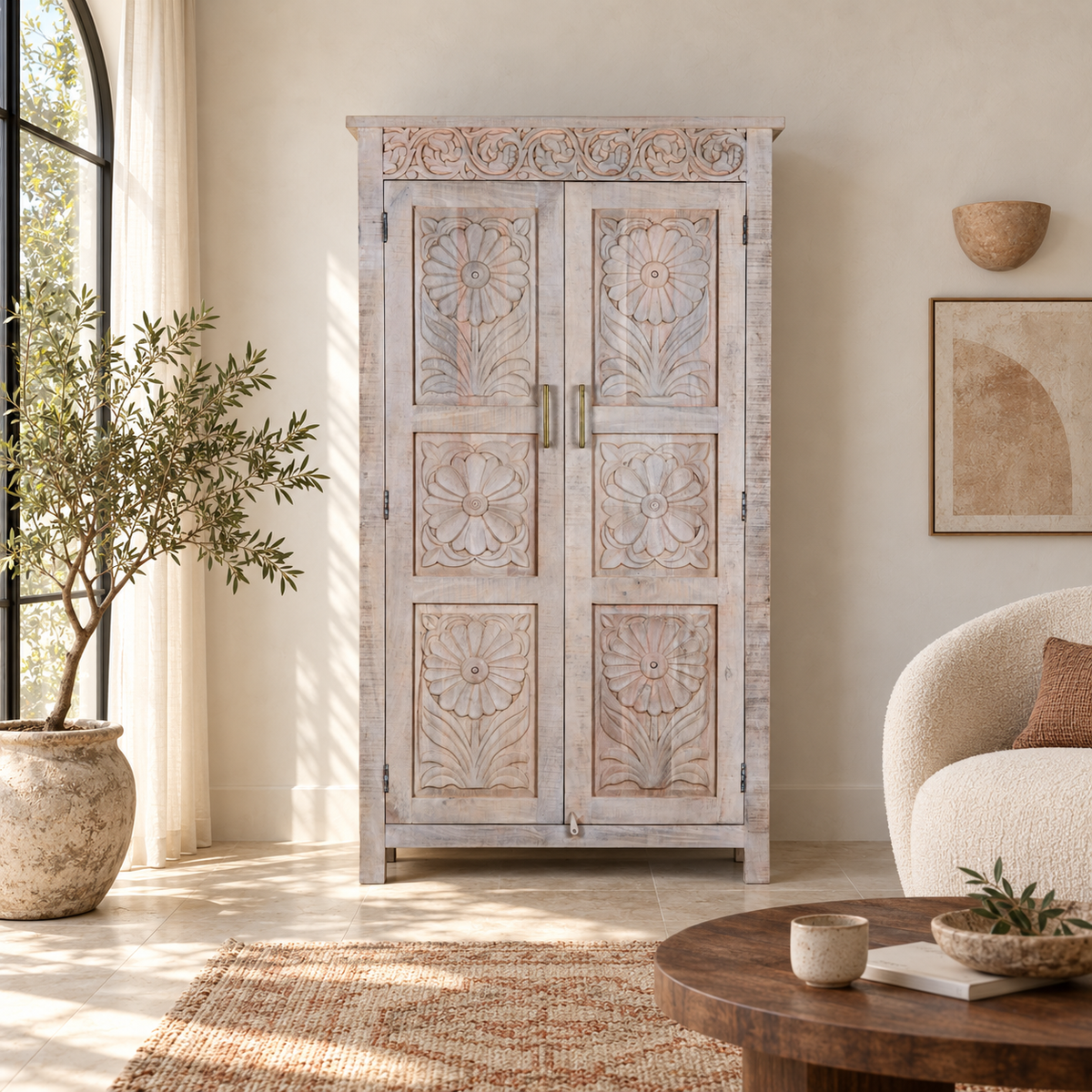 Lifestyle image of a hand carved mango wood wardrobe in floral design with ample storage in ibiza style.