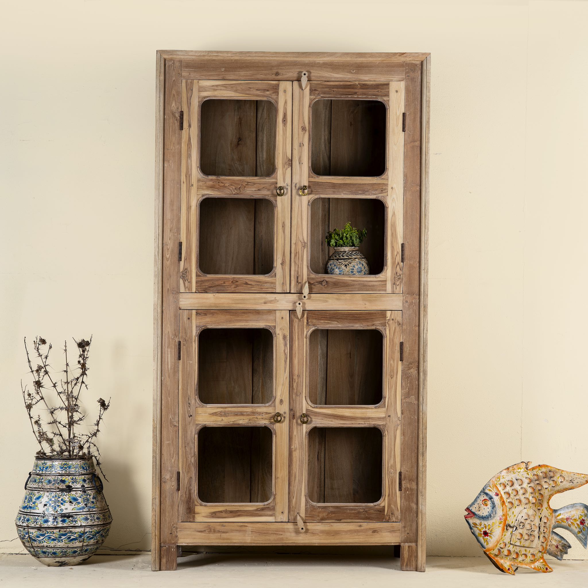 Chander tall vitrine with reclaimed teak door panels, a refined piece of teak wood furniture for living room furniture collections.