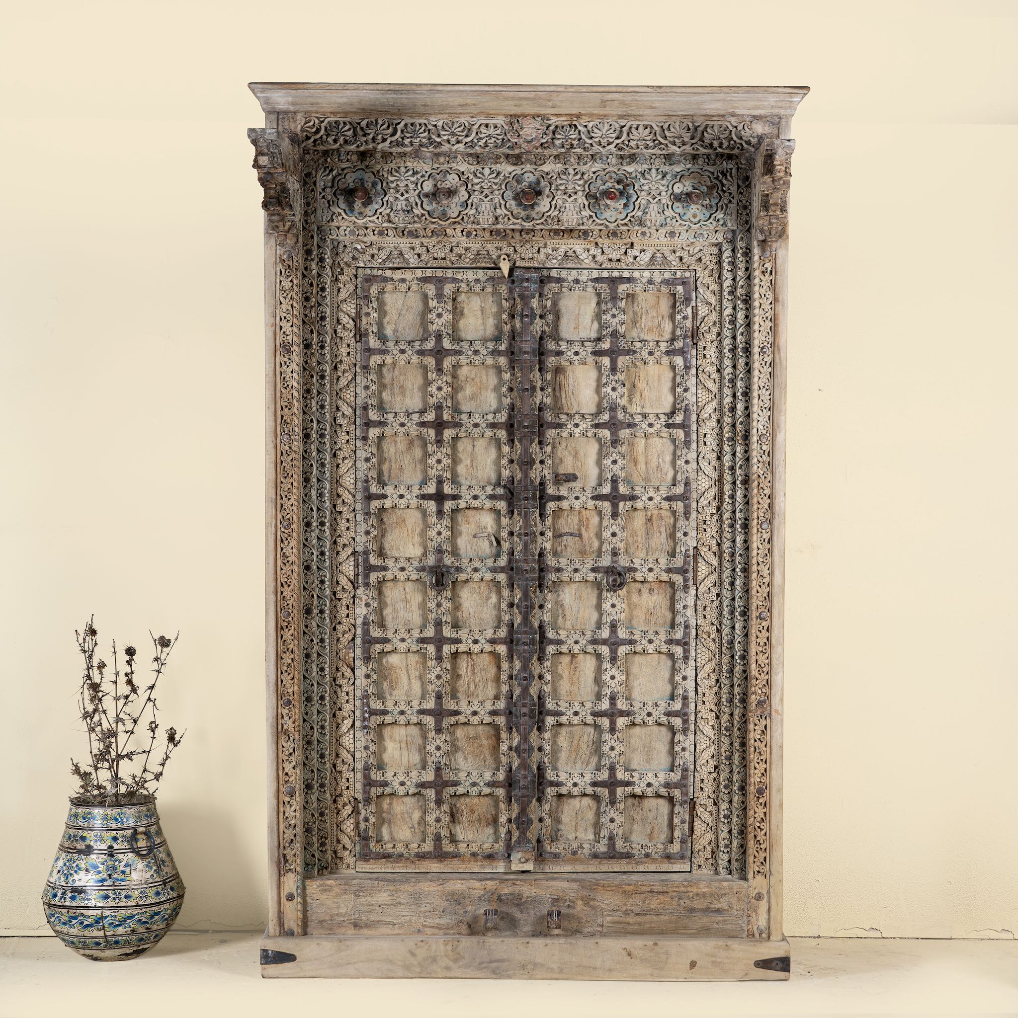 Solid reclaimed teak wooden wardrobe with hand-carved details, part of our premium teak wood furniture collection.