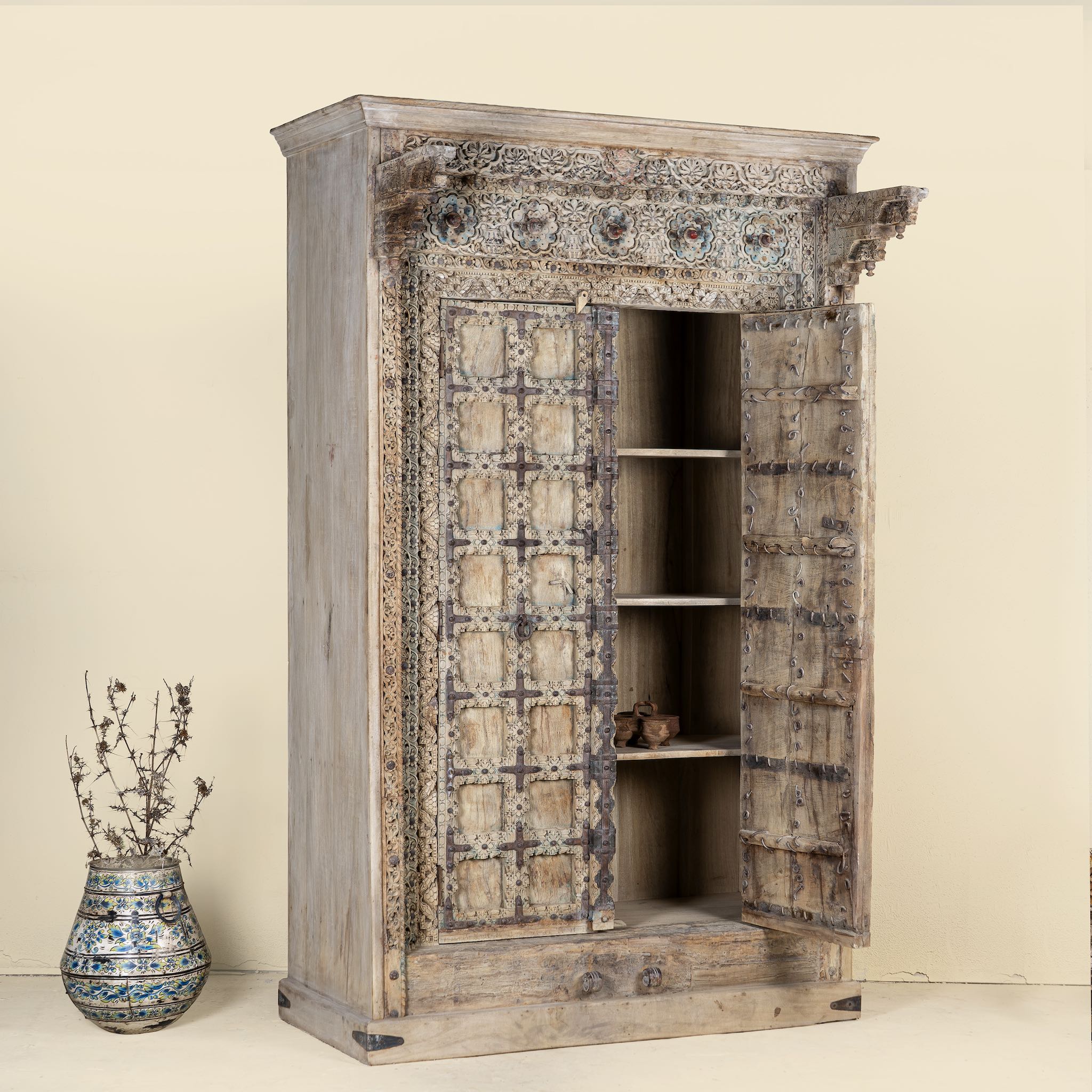 Open Door picture of a one-of-a-kind Indian solid reclaimed teak wooden wardrobe with hand-carved details, part of our premium teak wood furniture collection.