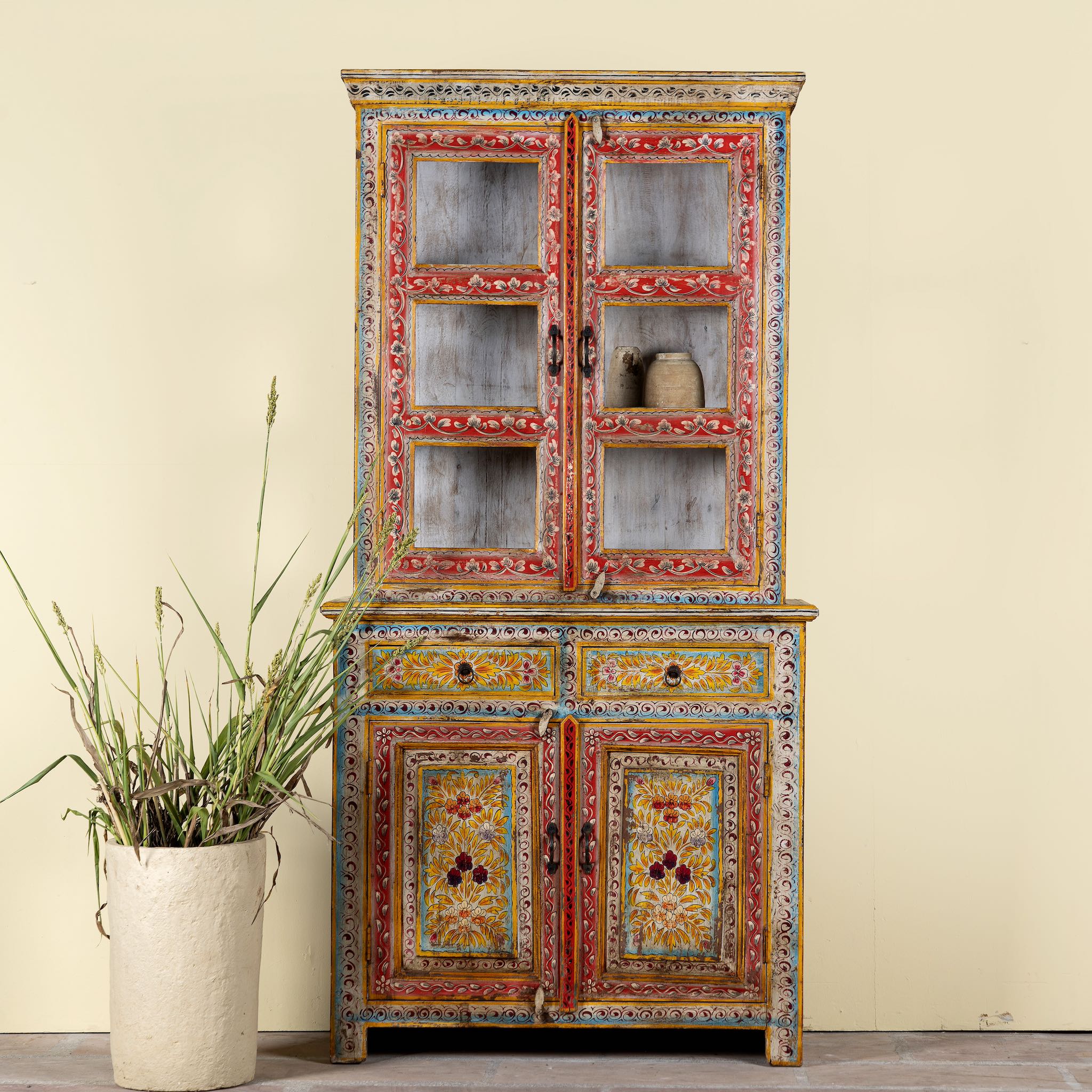 Hand-painted two-part showcase made of reclaimed wood with floral motifs; unique furniture for a boho chic living room, 94 × 48 × 203 cm.