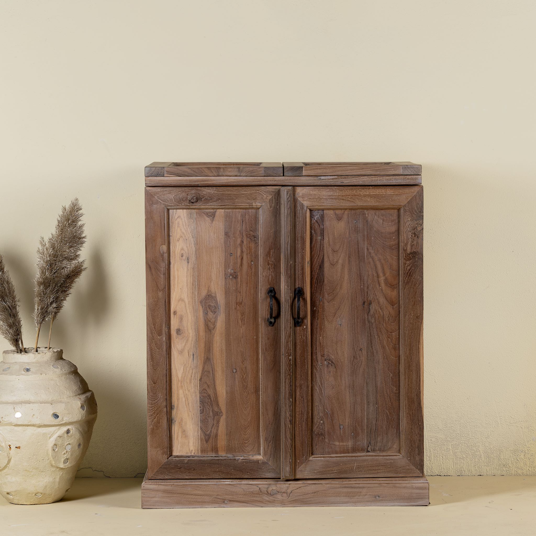 Foldable bar table made of reclaimed teak wood with inside storage.