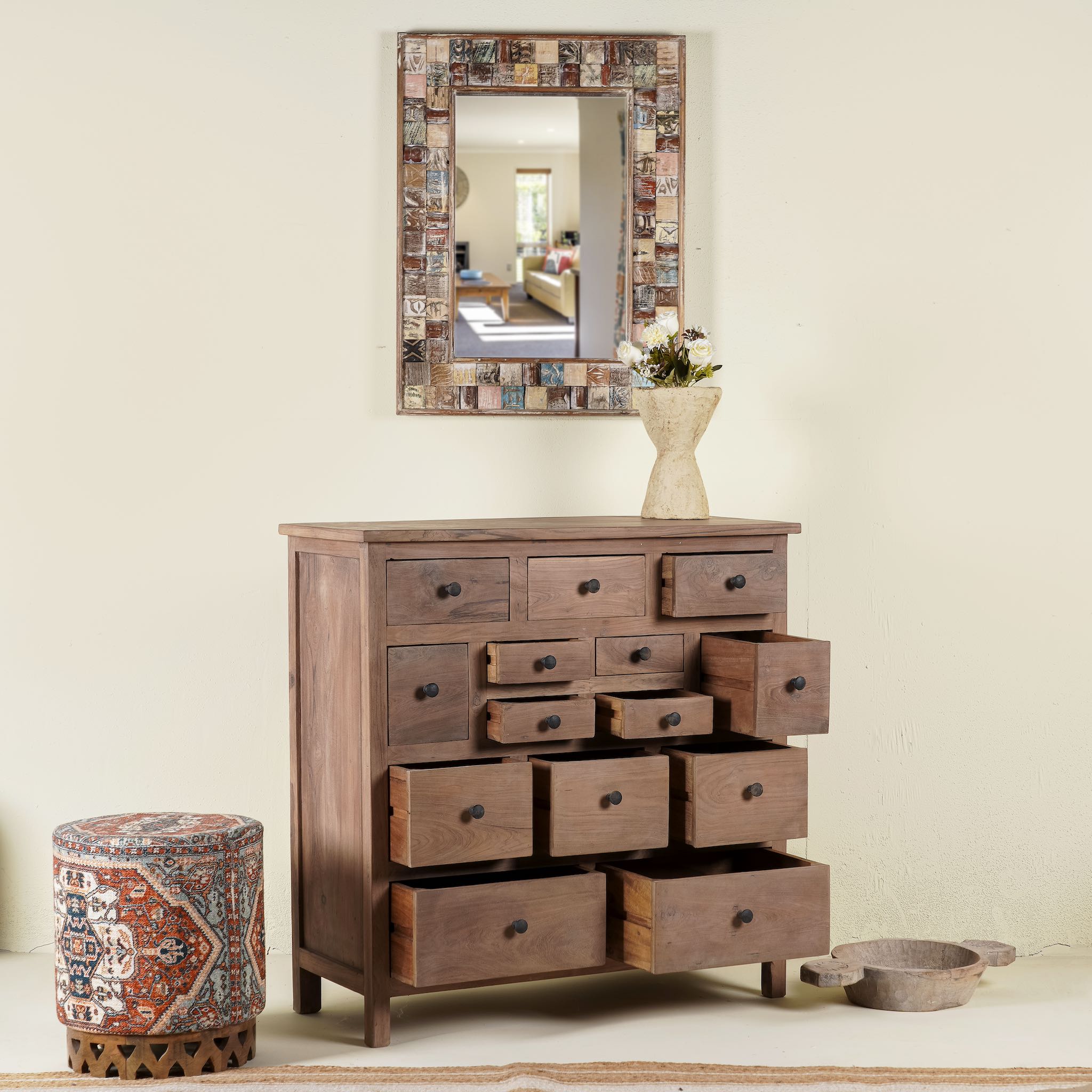 Side angle image with open drawers of a teak furniture chest of drawers made from reclaimed old teak wood, eco-friendly sustainable furniture in Ibiza style, 100 × 40 × 100 cm.