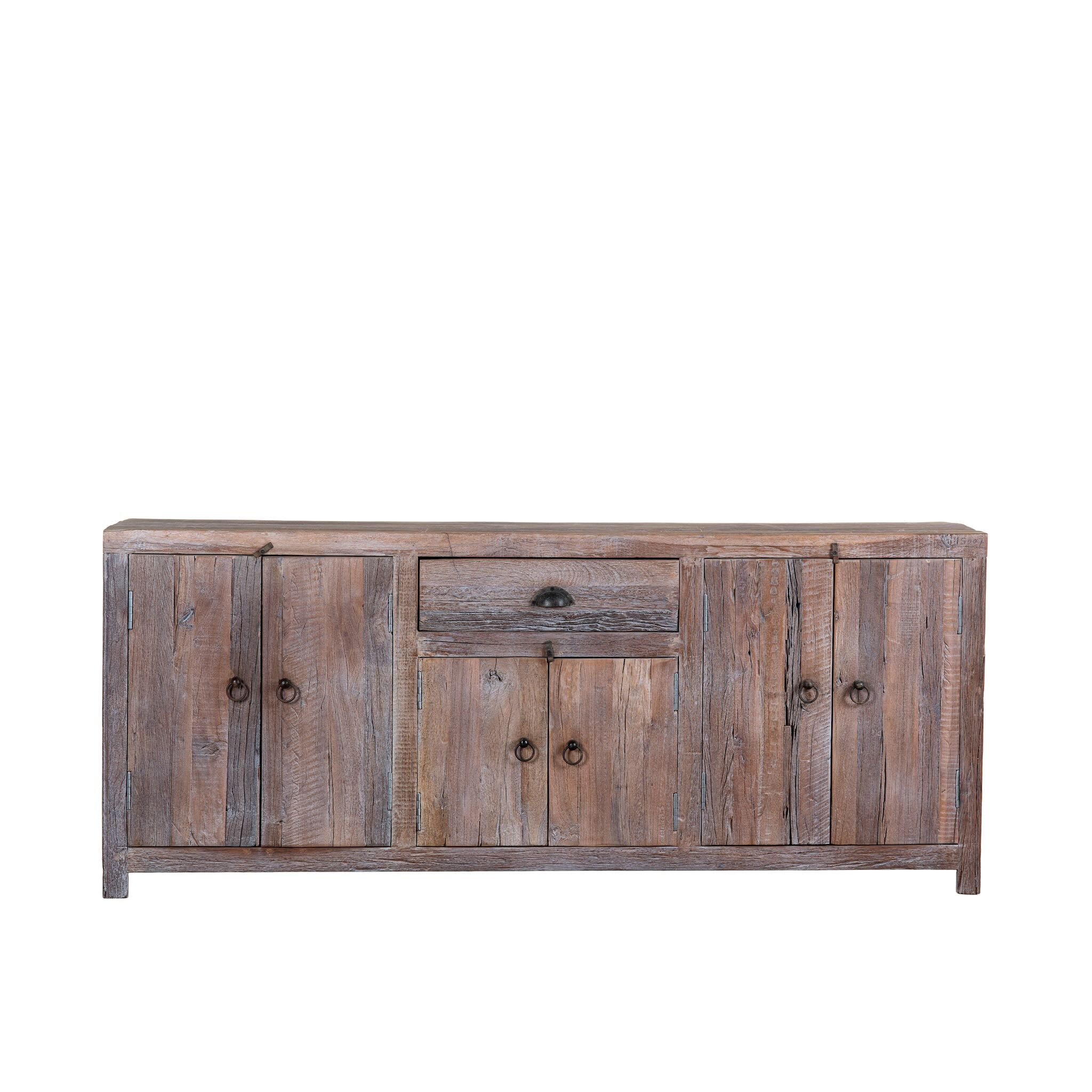 White background image of a reclaimed wood sideboard Devina in rustic minimalistic style with cabinet doors and central drawer. A sustainable furniture piece showcasing natural wood grain and timeless simplicity.