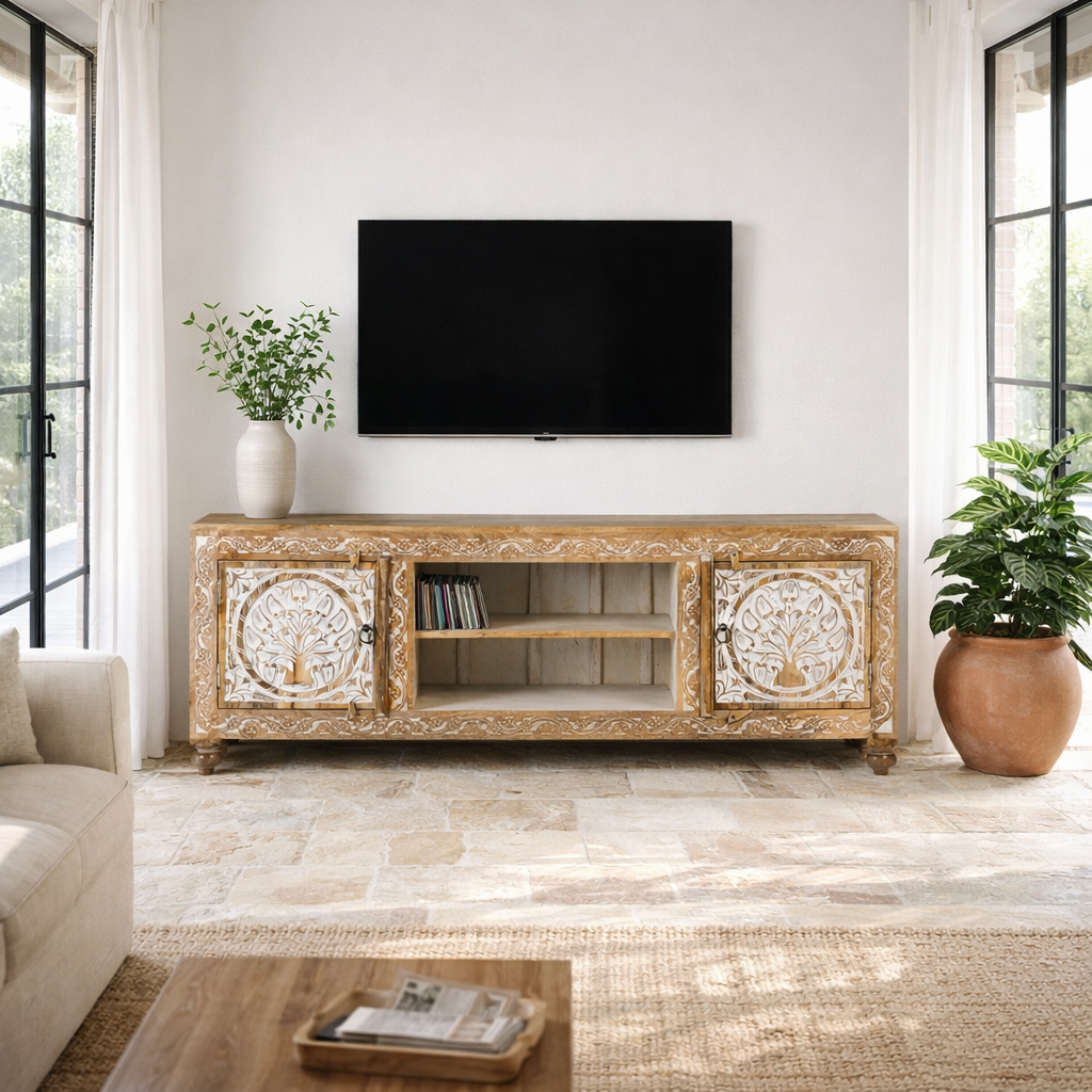 Lifestyle image of a whitewashed carved console table made of mango wood with floral motifs, four compartments; artisanal living room furniture, 180 × 40 × 65 cm.