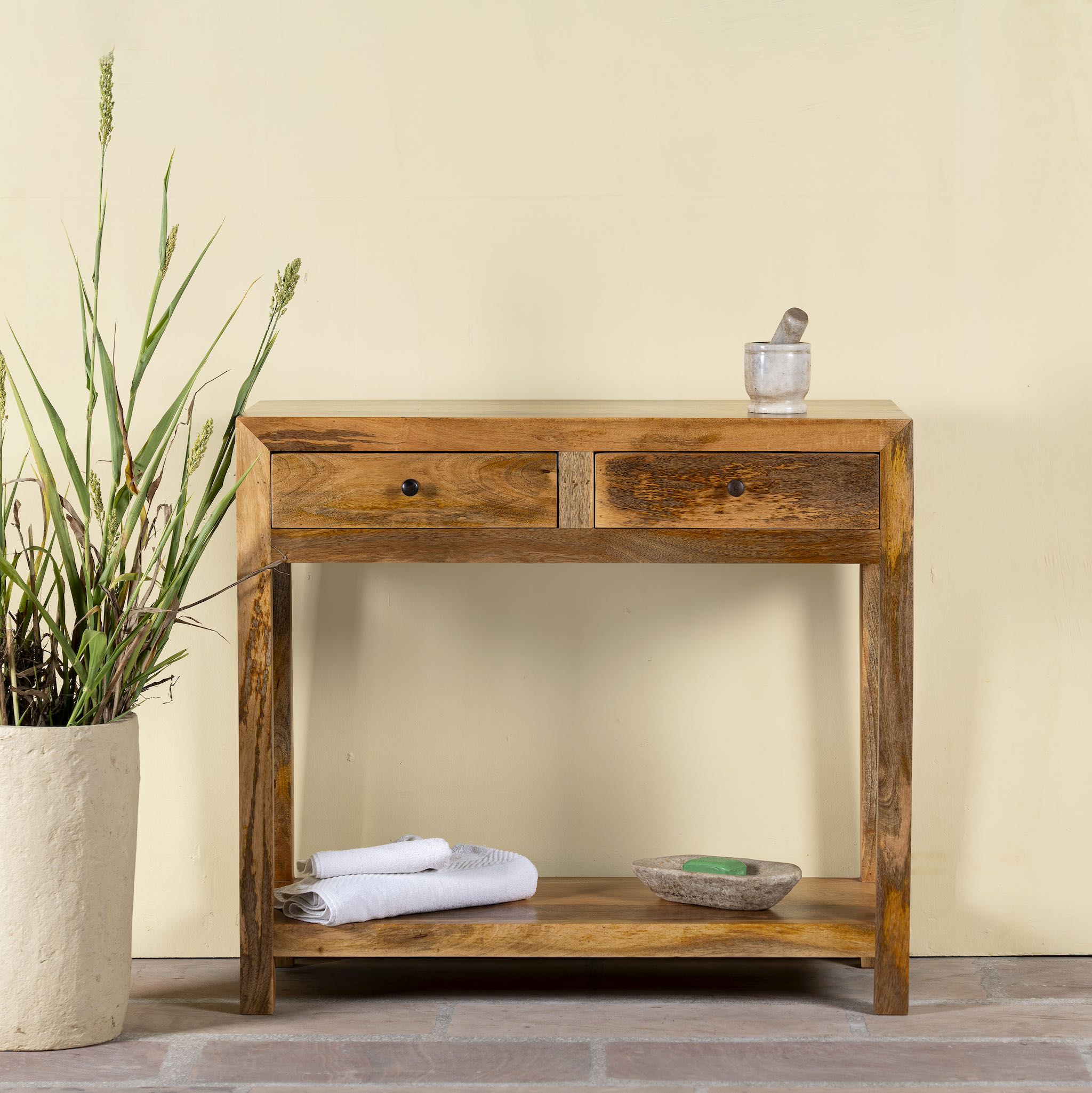Ibiza style Mango wood console table with two drawers and bottom shelf, warm natural finish, 100 × 40 × 90 cm.