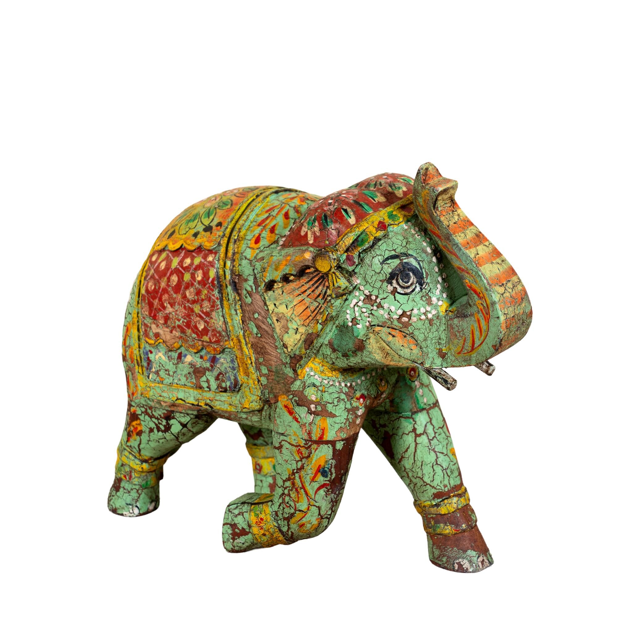 White background image of a Hand‑painted wooden elephant decoration with colourful folk art motifs, a unique Indian home accessory and vintage home decor accent.