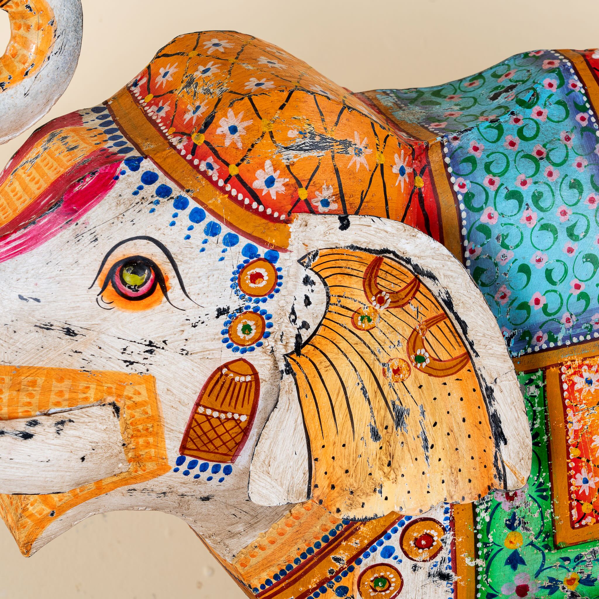 Close up image of a handcrafted metal elephant sculpture with painted finish – a unique painted metal decoration perfect for vintage home decor and artistic interiors.