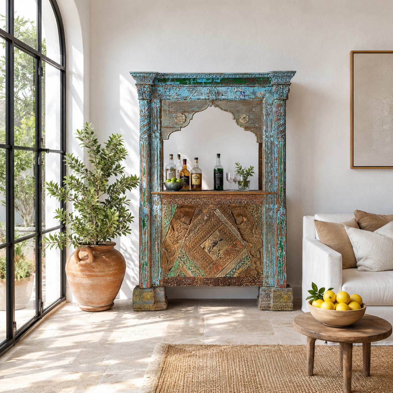 Lifestyle image of a vintage bar made of reclaimed antique teak wood with hand-carved detailing, unique wooden furniture with storage, 160 × 60 × 213 cm.