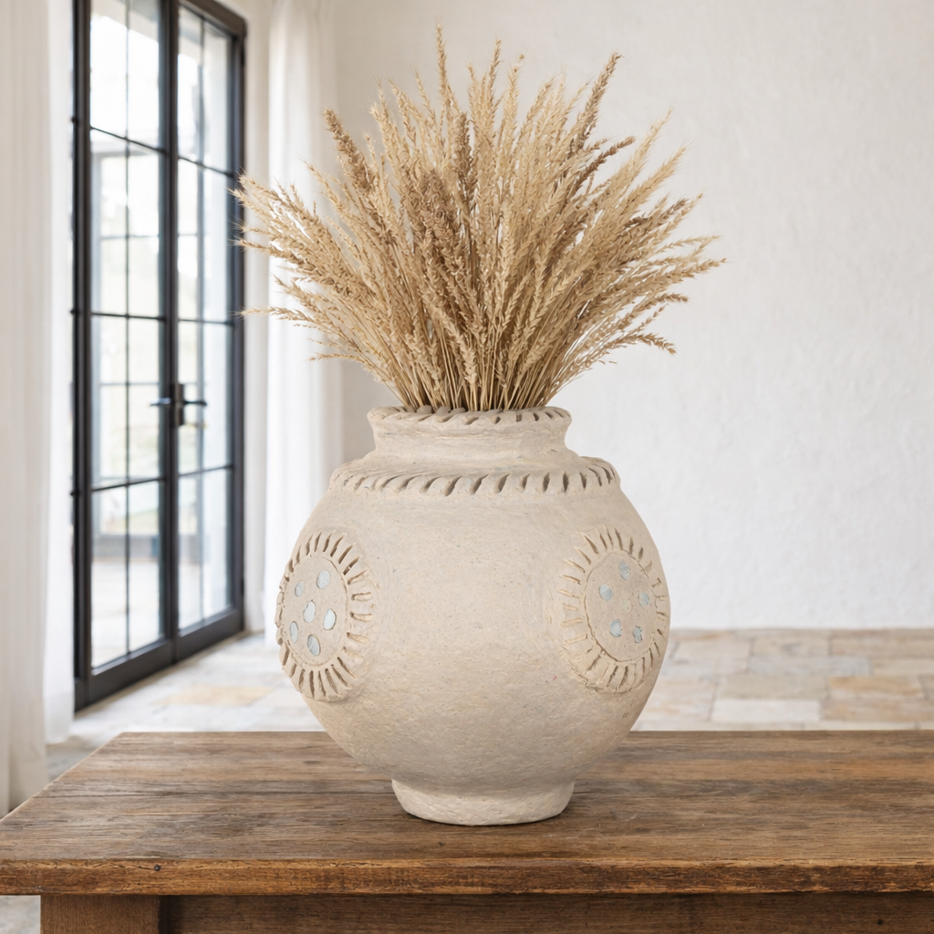 Lifestyle image of a handmade papier-mâché vase Peda with mirror-inlaid medallions and textured rim. A vintage home accessory and unique Indian decoration, perfect for dried flowers or as a sculptural accent in vintage home decor.