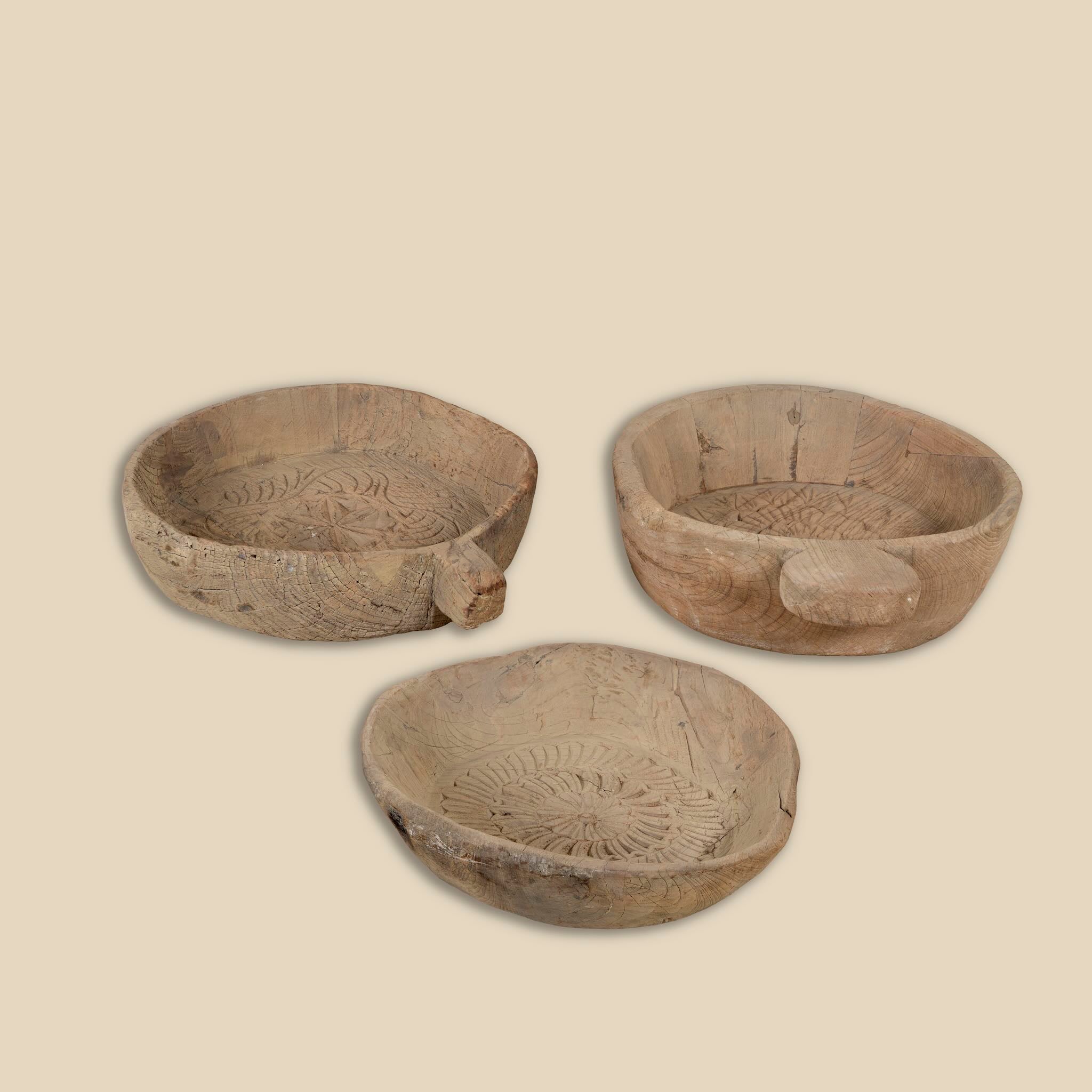 Hand-carved old teak wood plate with traditional Indian motifs and rustic finish, ideal for vintage home decoration and Indian home decor.