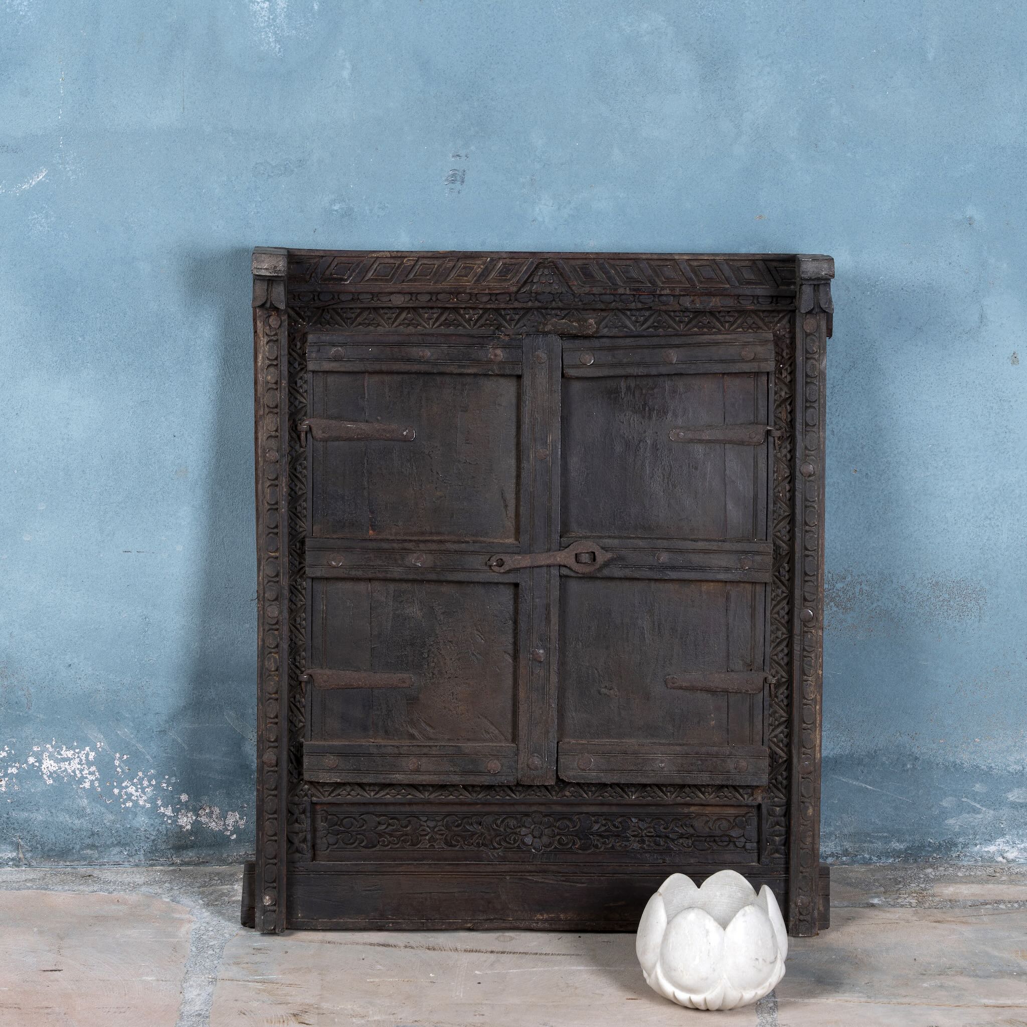 Hand-carved white marble vase Ishika in a lotus flower shape. A vintage home accessory crafted from natural stone, perfect for vintage home decor and small floral or incense displays.