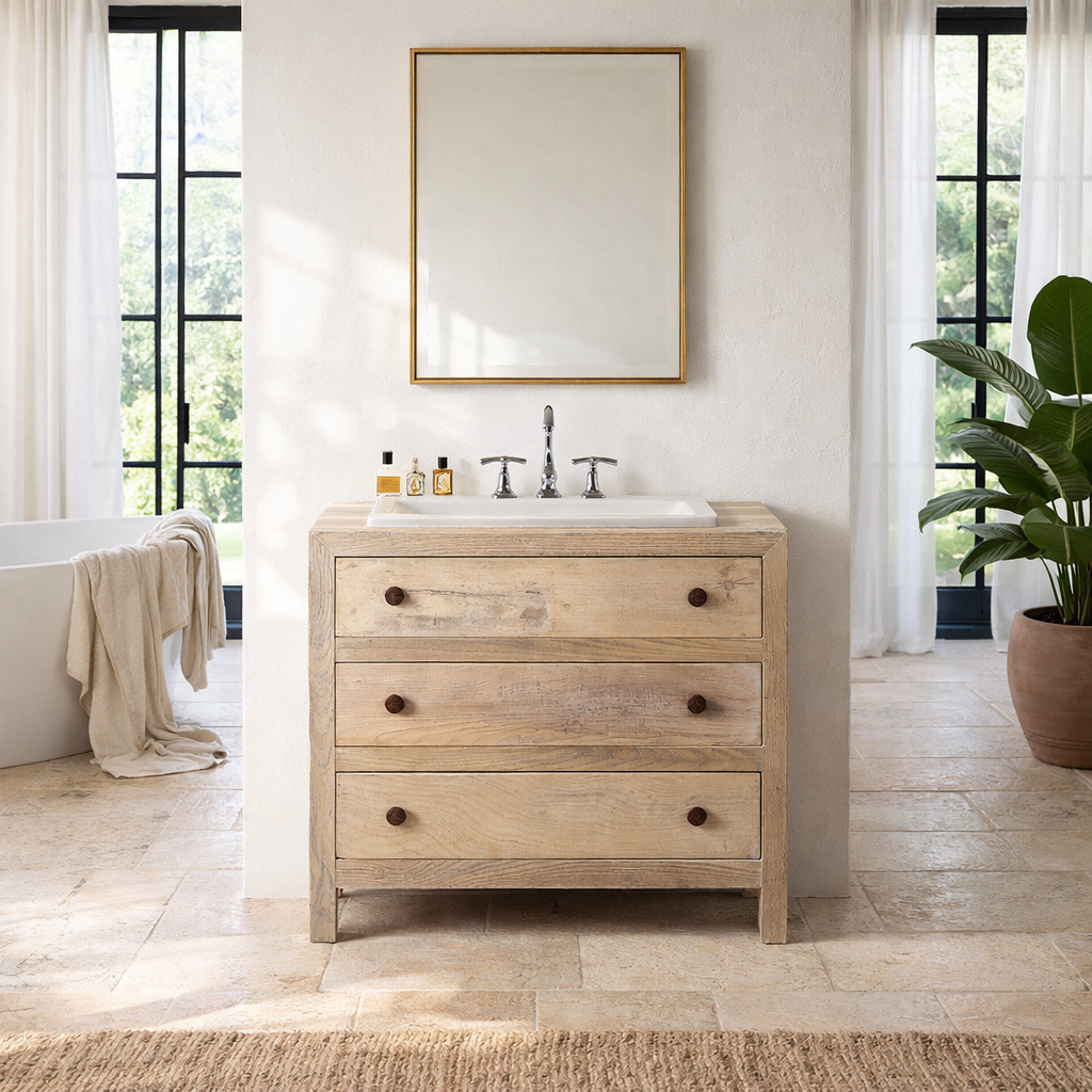 Lifestyle image of a reclaimed wood chest of 3 drawers with rustic finish and round knobs; Ibiza style sustainable furniture, 90 × 50 × 80 cm.