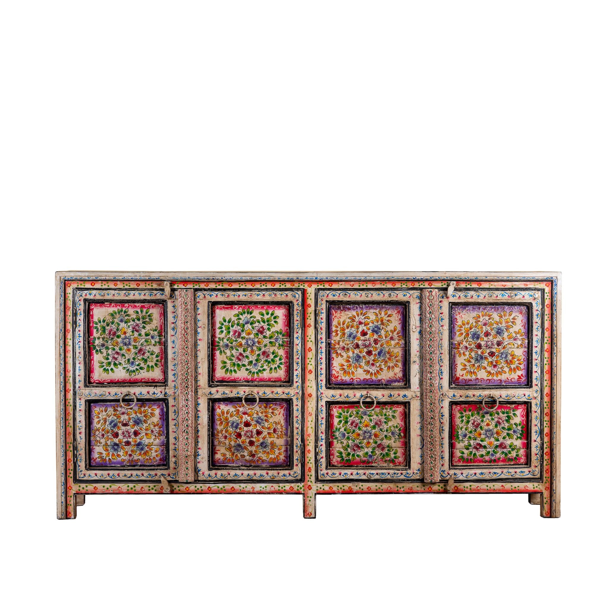 White background image of a boho style hand painted sideboard with reclaimed old Indian door decoration. Unique cabinet with floral design.