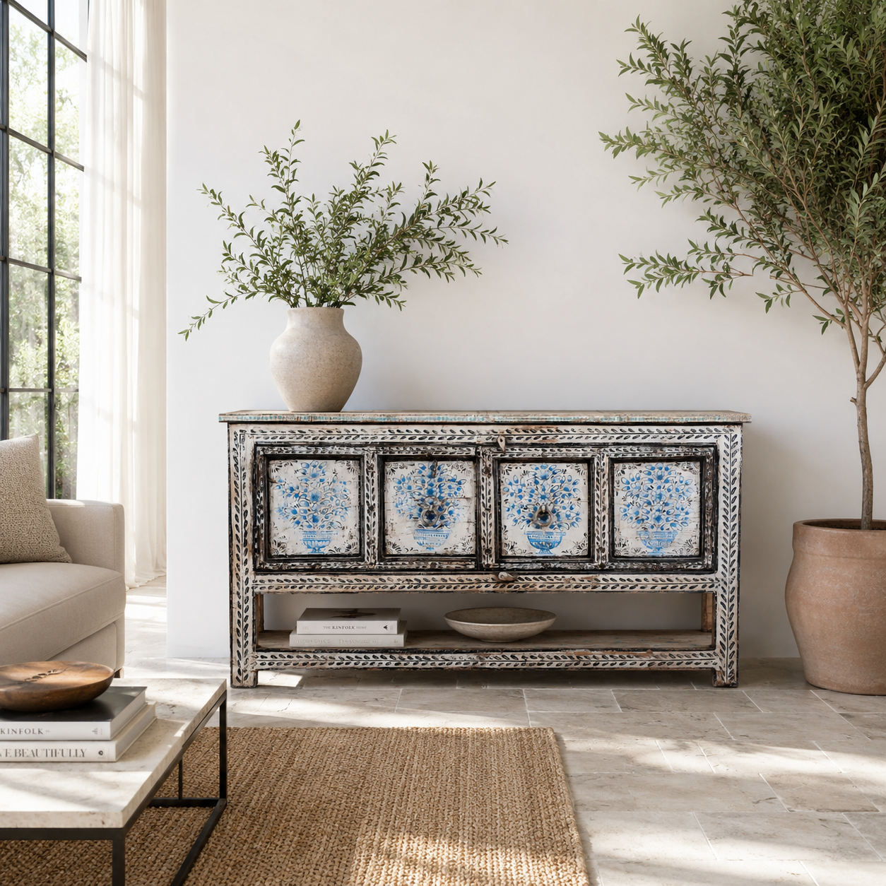 Lifestyle image of a hand painted console table with 2 doors and plenty of inside storage made of reclaimed old wood in Boho style.