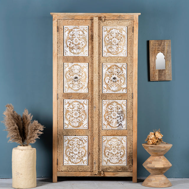 Hand carved wooden wardrobe made of solid mango wood with whitewashed floral details; Ibiza-style mango wood wardrobe, 190 × 100 × 40 cm.