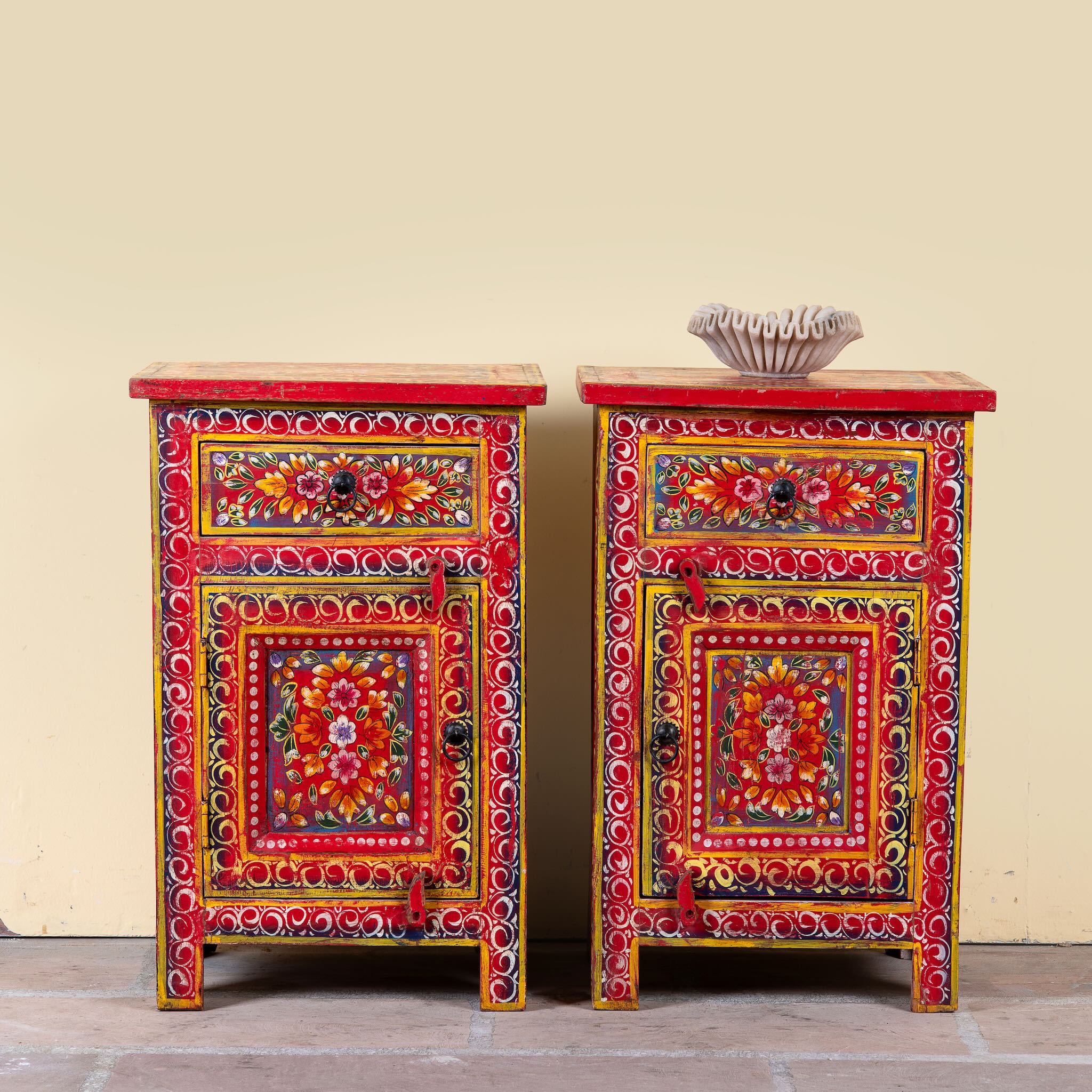 Joven pair of hand painted reclaimed wood nightstands with one drawer, one cabinet door, floral artwork, and vibrant red boho style finish.