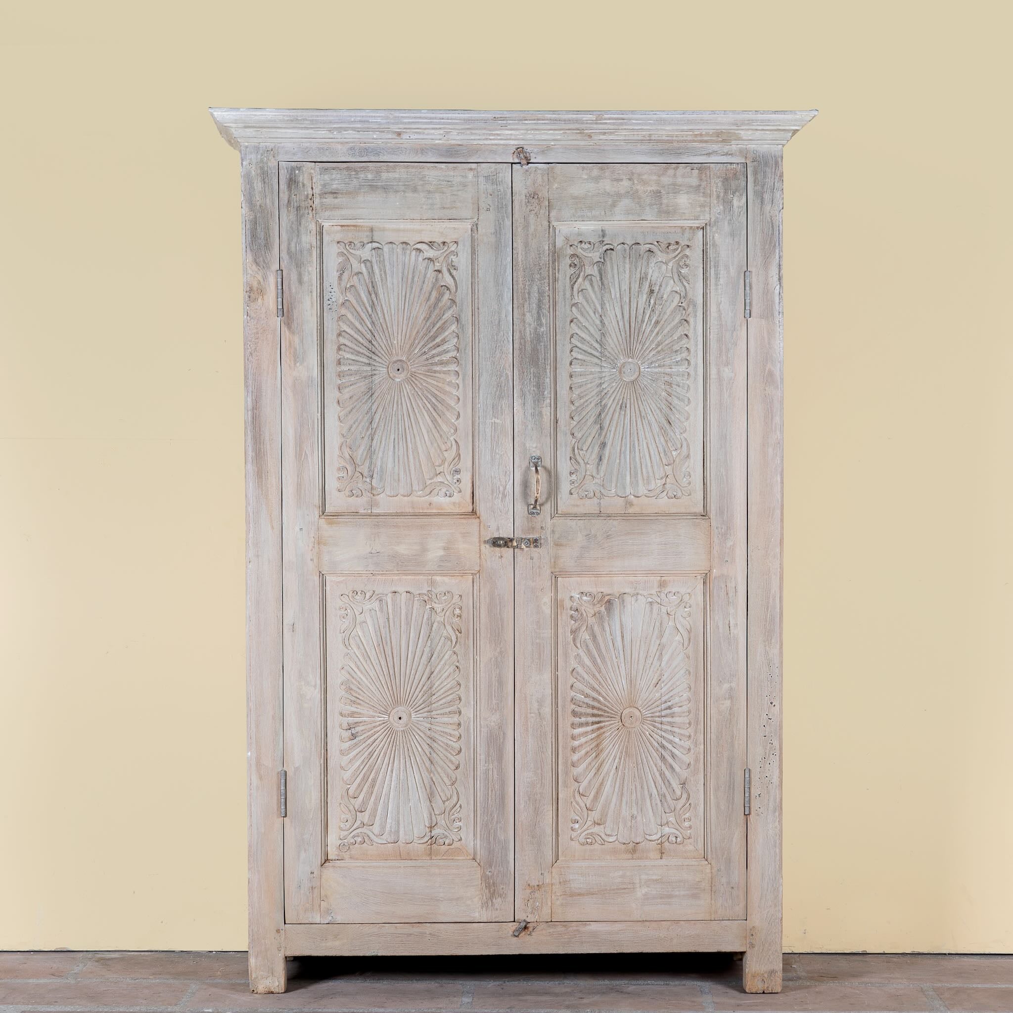 Kaiden reclaimed teak wood wardrobe with hand-carved Indian details, double doors, and vintage whitewashed finish.