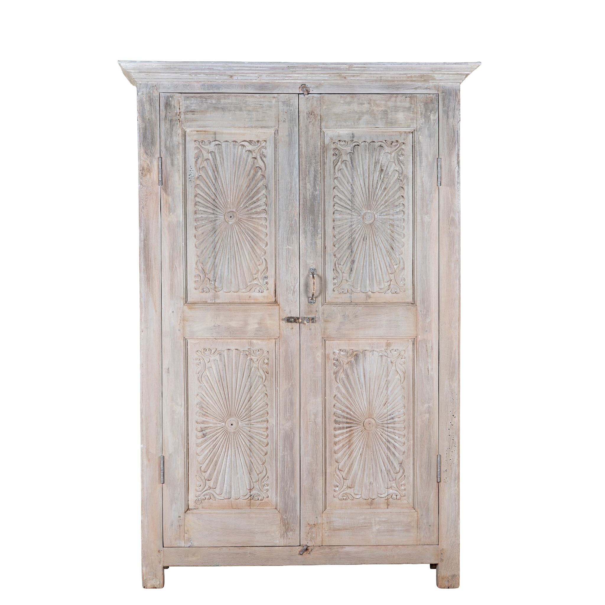 White background image of a Kaiden reclaimed teak wood wardrobe with hand-carved Indian details, double doors, and vintage whitewashed finish.