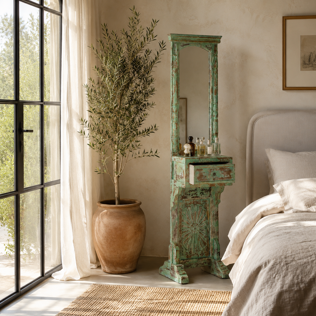 Lifestyle image of a green shabby-style mirror stand Kalapet made of reclaimed wood with one drawer and distressed finish. A unique Indian furniture piece perfect for vintage home decor.