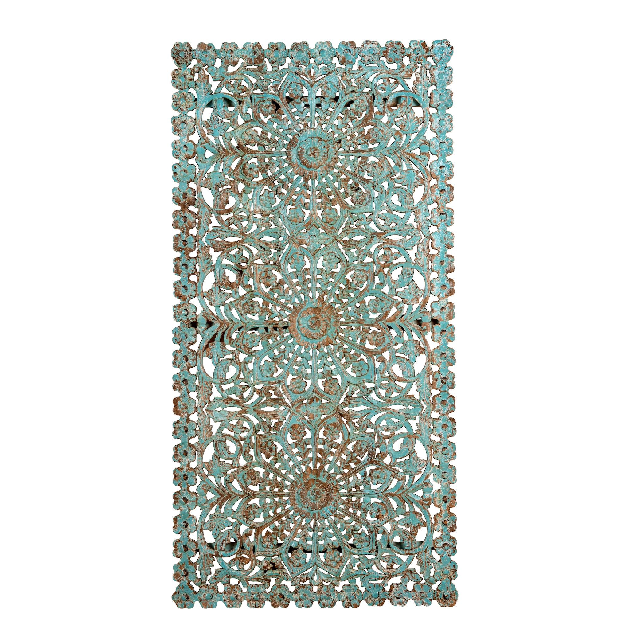White background image of a hand-carved mango wood wall panel with floral motifs in blue finish – Kataee Blue model by Om Home & Garden