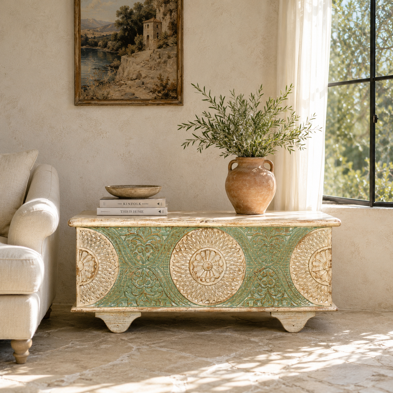 Lifestyle image of a hand-carved mango wood vintage chest with whitewashed finish and iron fittings – elegant storage for bohemian or rustic interiors.