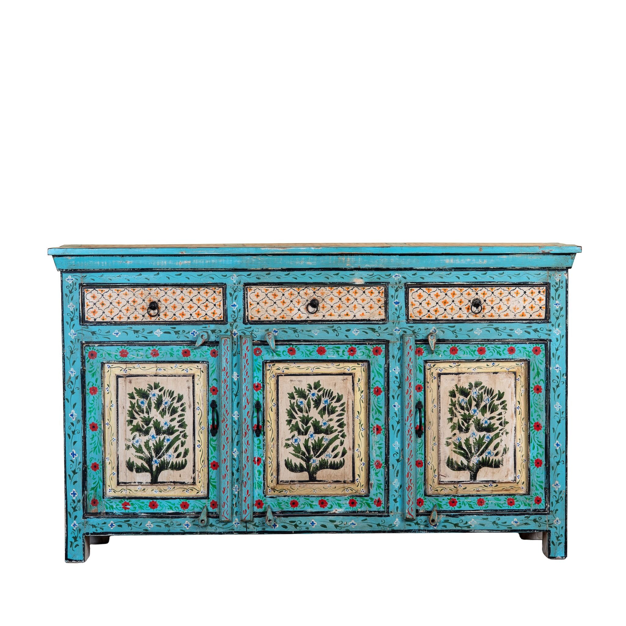 White background image of a Kaveh hand painted reclaimed wood sideboard in boho style with three doors, three drawers, floral details, and distressed turquoise finish.