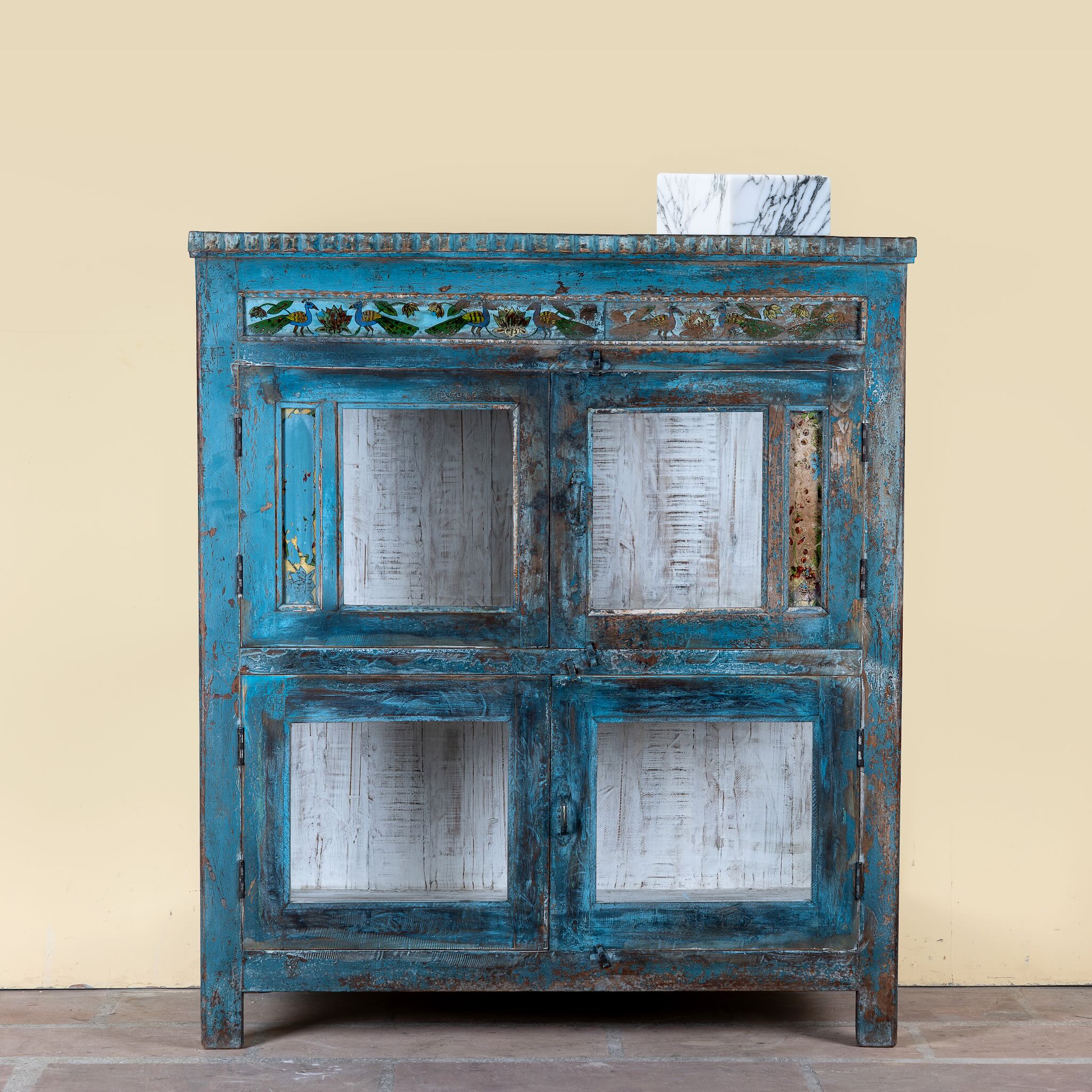 Kavish vintage blue reclaimed teak wood wardrobe with peacock reverse glass paintings and distressed Indian finish.