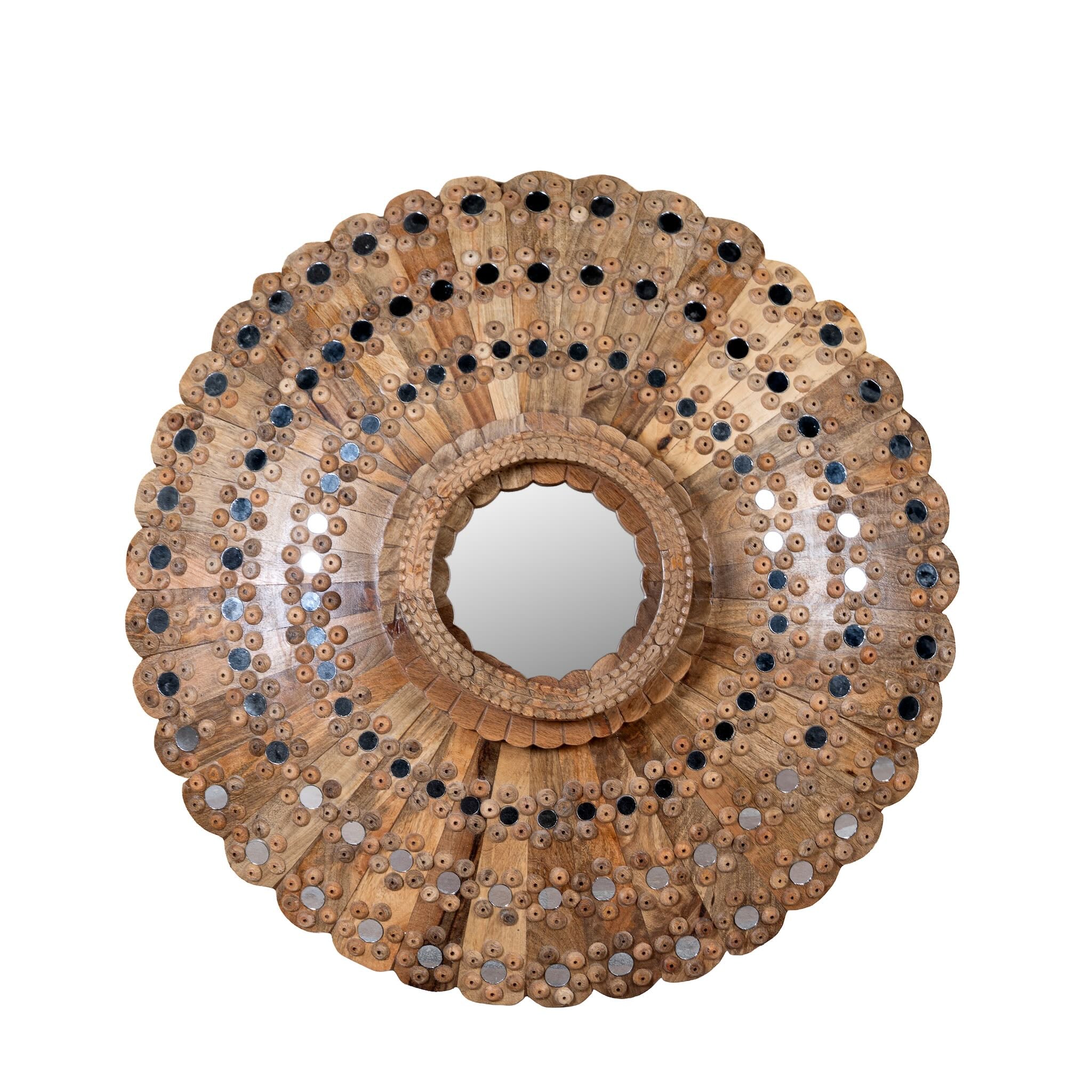 White background image of round mango wood mirror Kiaan with concentric carved design and mirror inlays. A piece of unique wall decor combining artisanal craftsmanship and rustic bohemian charm.